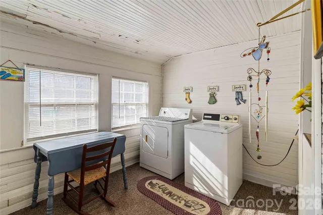 a view of a room that has a couch and a stove in it