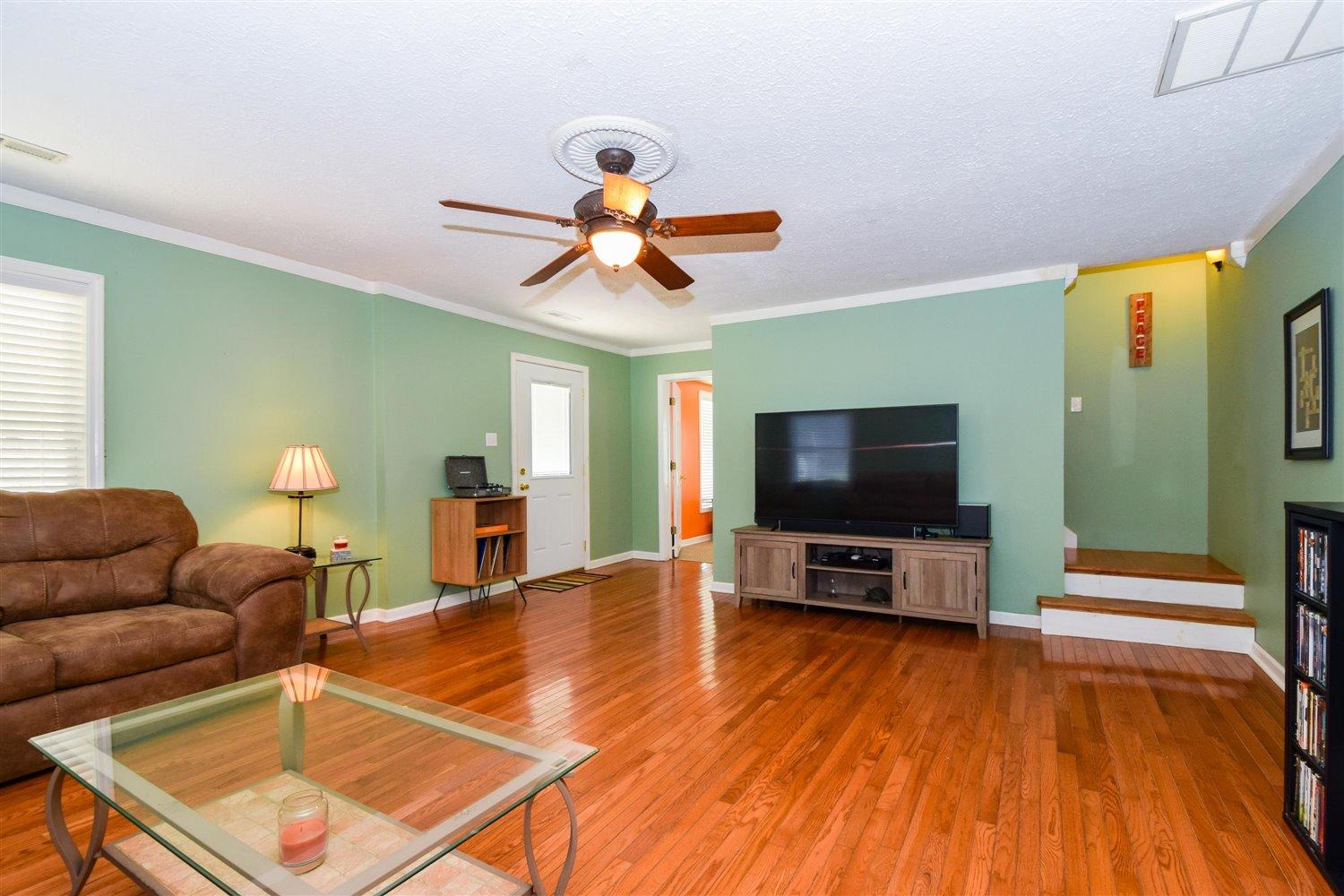 2677 Webster Road Blue Ridge, VA 24064 - Photo 2 of 35 a living room with furniture and a flat screen tv