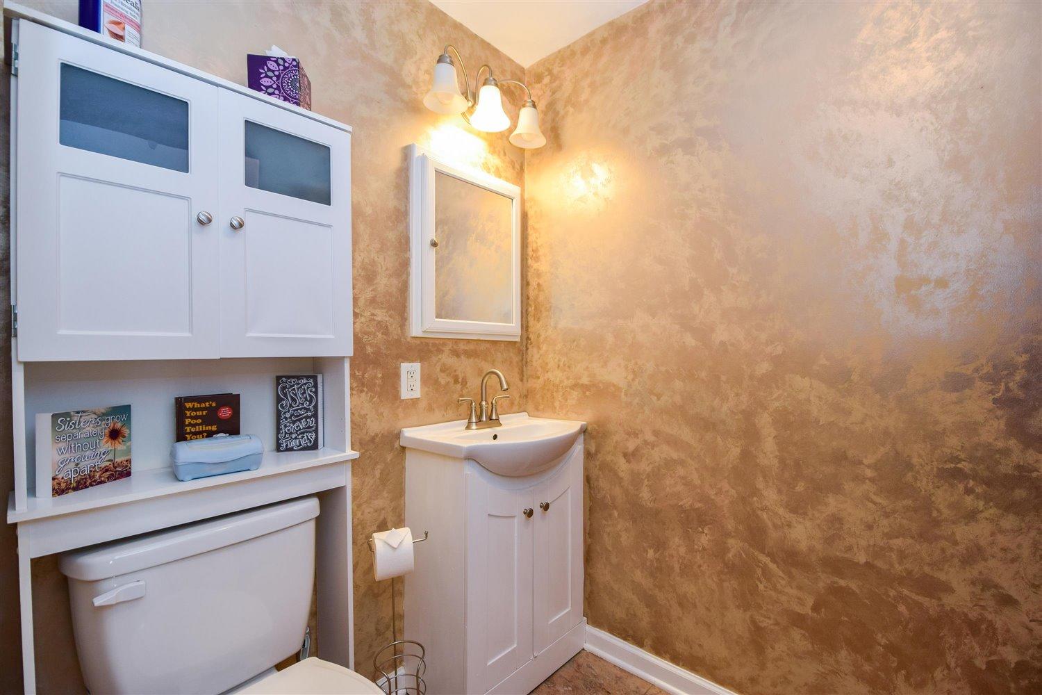 2677 Webster Road Blue Ridge, VA 24064 - Photo 19 of 35 a bathroom with a toilet sink and mirror