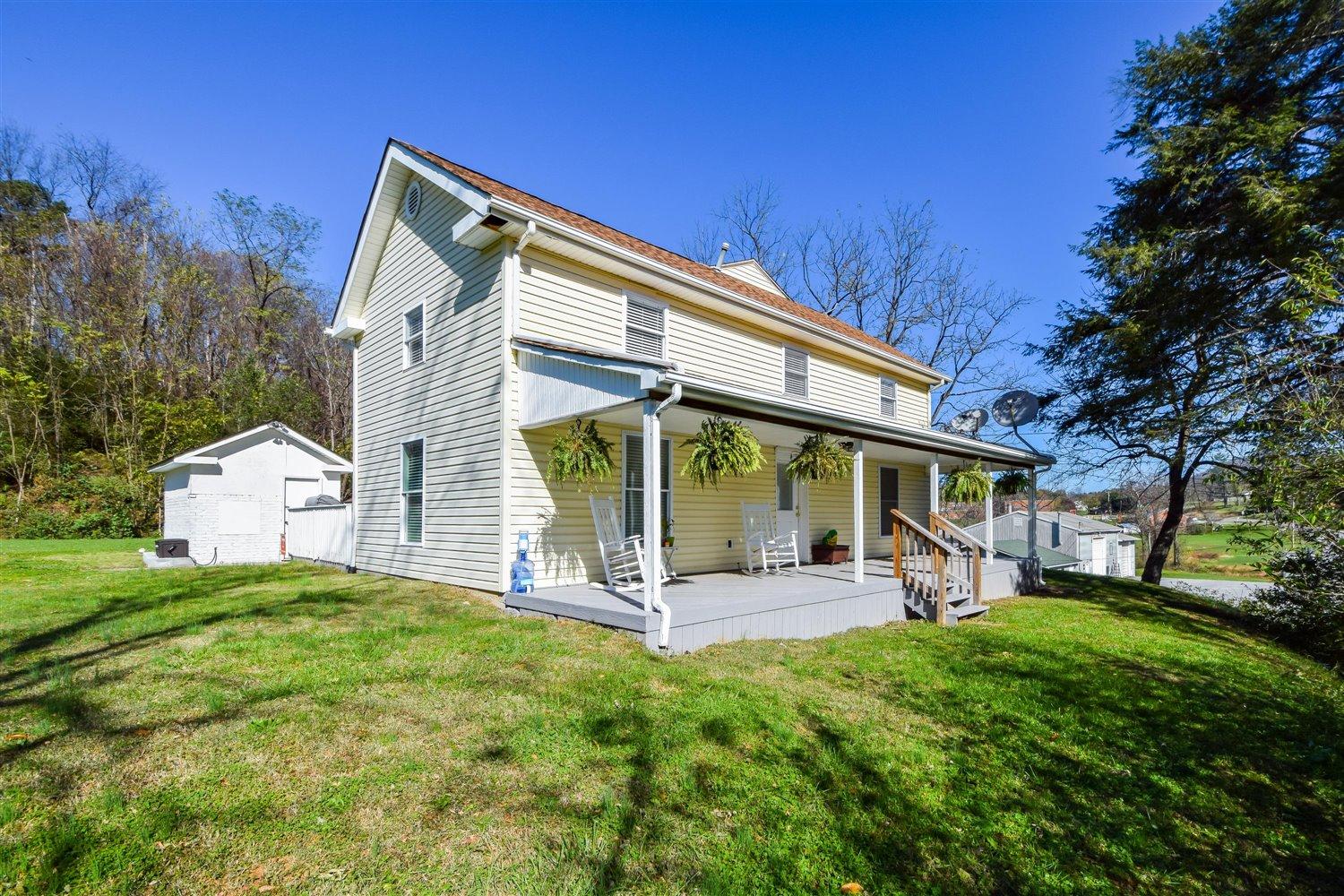 2677 Webster Road Blue Ridge, VA 24064 - Photo 20 of 35 a view of a house with a yard patio and fire pit
