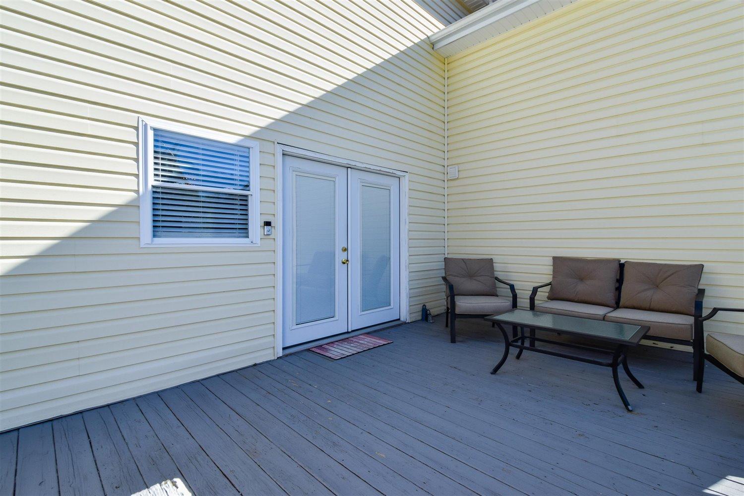 2677 Webster Road Blue Ridge, VA 24064 - Photo 26 of 35 a backyard of a house with wooden floor chairs