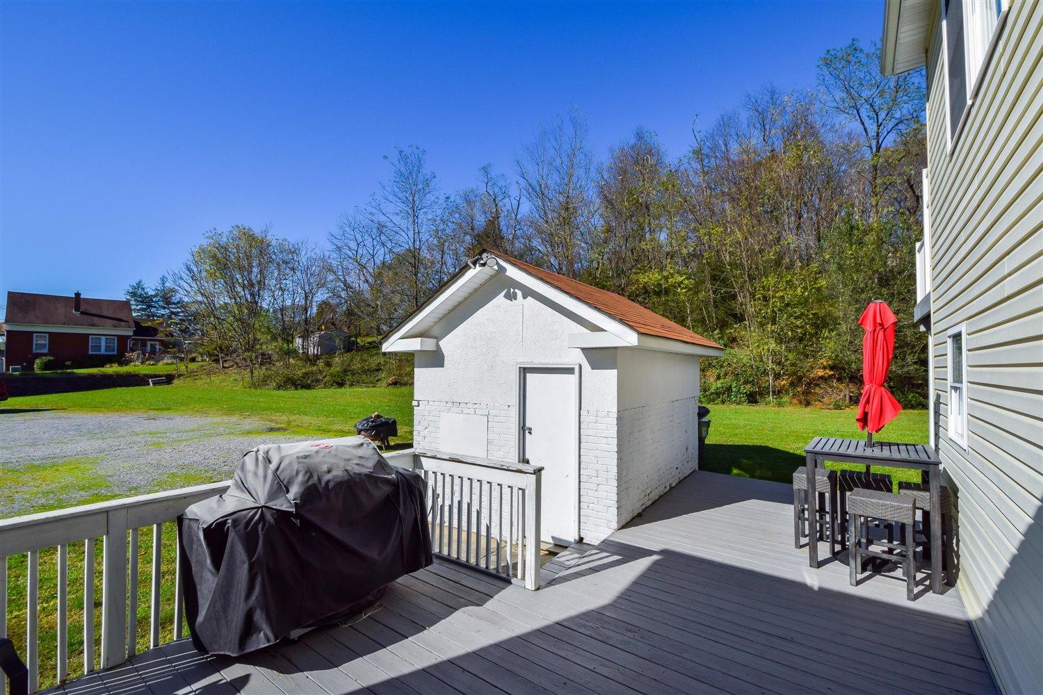 2677 Webster Road Blue Ridge, VA 24064 - Photo 28 of 35 a view of a house with backyard and sitting area