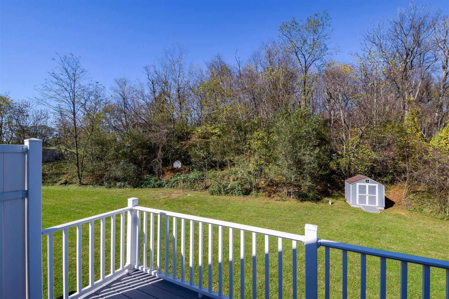 2677 Webster Road Blue Ridge, VA 24064 - Photo 32 of 35 a view of a wooden deck with a yard