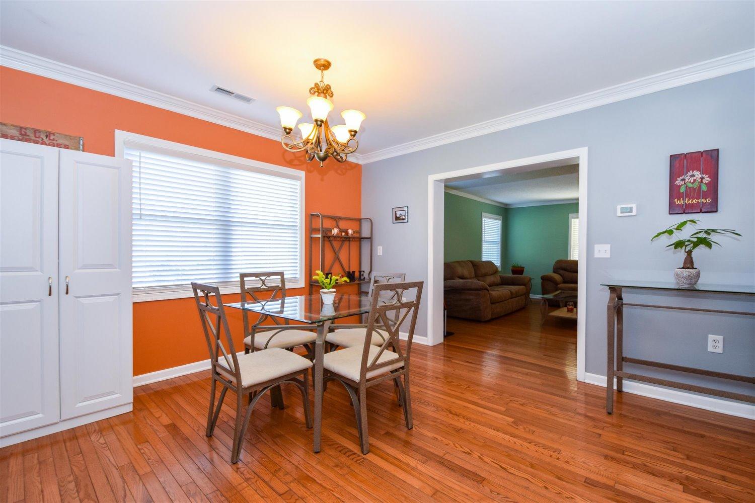 2677 Webster Road Blue Ridge, VA 24064 - Photo 5 of 35 a view of a dining room with furniture a chandelier and wooden floor