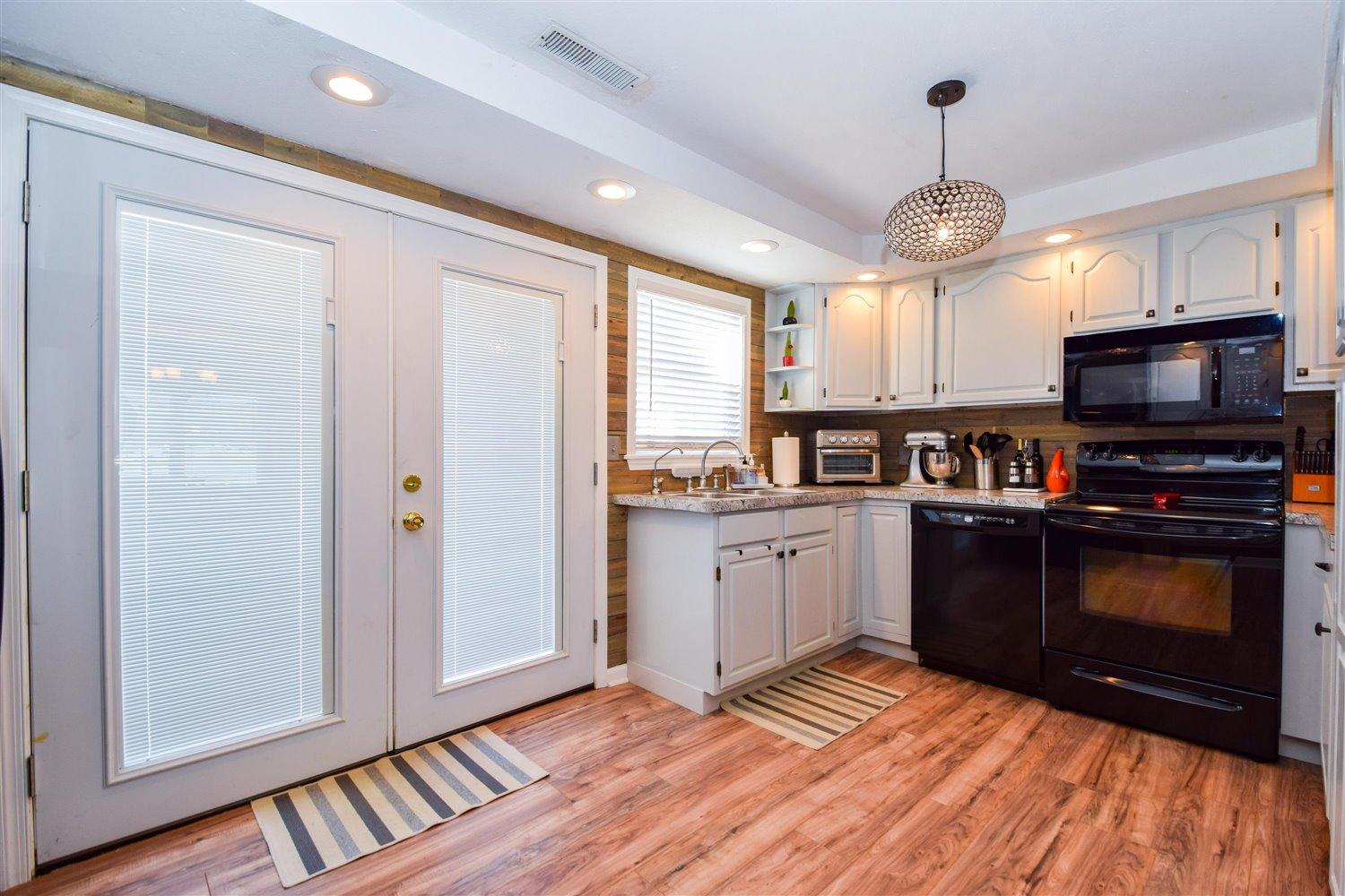 2677 Webster Road Blue Ridge, VA 24064 - Photo 8 of 35 a kitchen with granite countertop stainless steel appliances and wooden floor