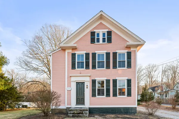 a front view of a house with a yard