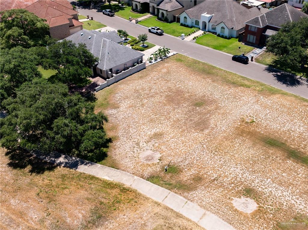 2109 Pecos Street Mission, TX 78572 - Photo 3 of 7 an aerial view of a house with a yard and mountains