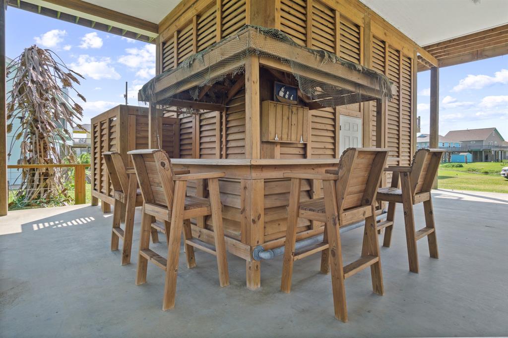 a view of a patio with a table and chairs