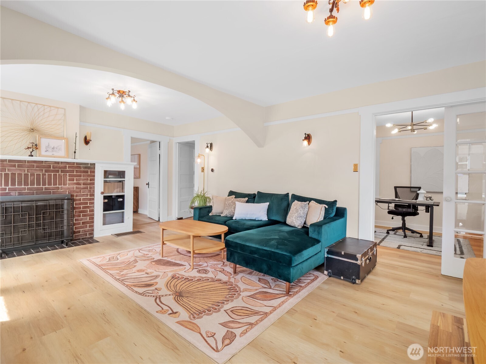 9701 Roosevelt Way Northeast Seattle, WA 98115 - Photo 4 of 33 a living room with furniture and a fireplace