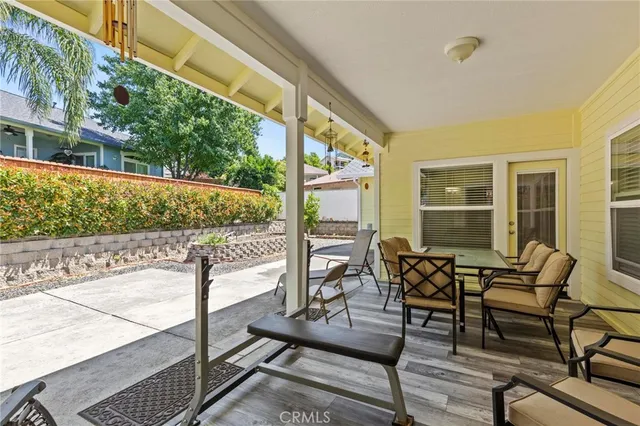 an aerial view of a residential house with an outdoor space