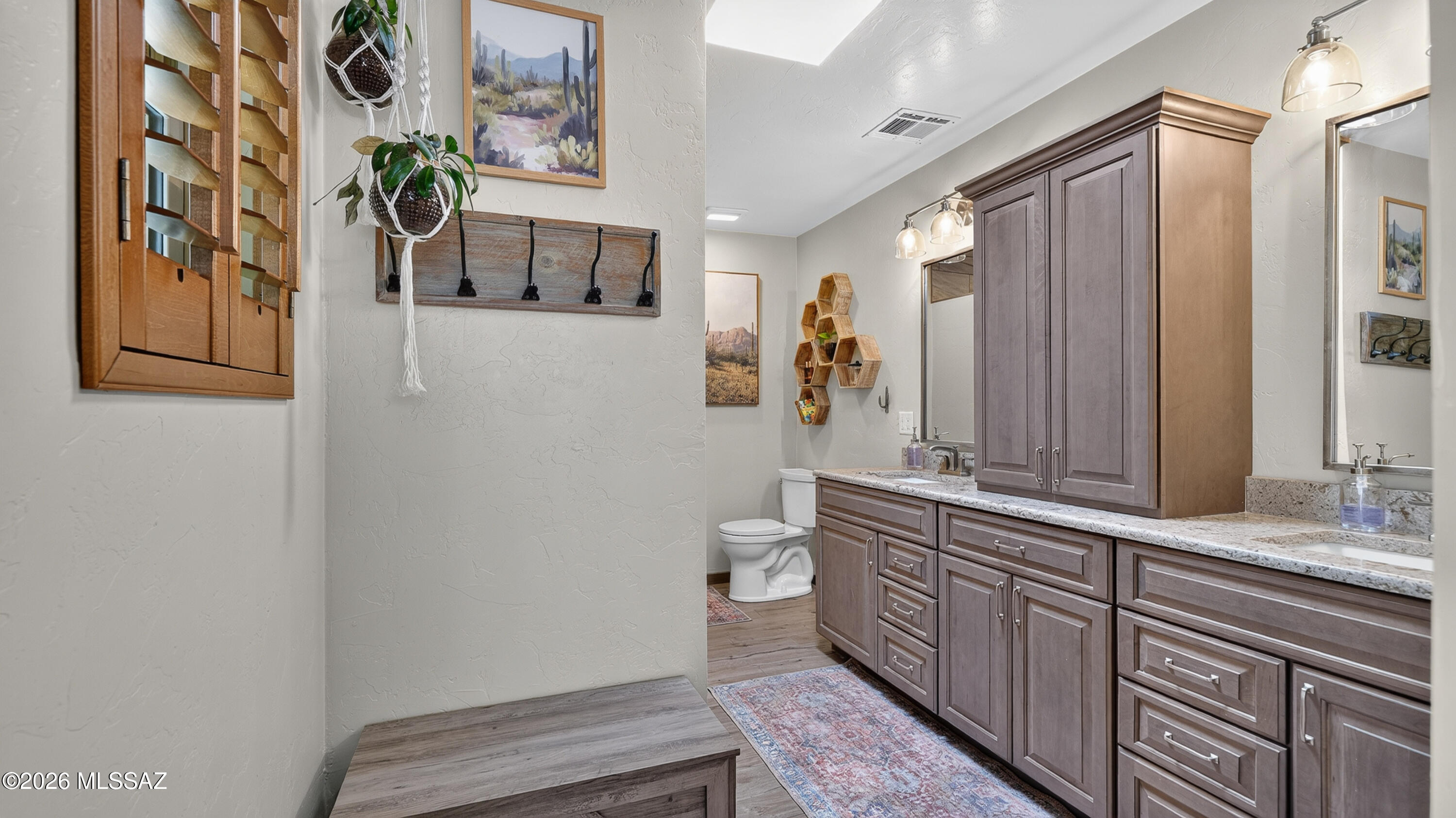 194 Taylor Road Willcox, AZ 85643 - Photo 27 of 54 Primary bathroom features a spacious double vanity with Cambria quartz countertops, dual undermount sinks, solid wood cabinetry, and upgraded soft-close doors and drawers throughout.