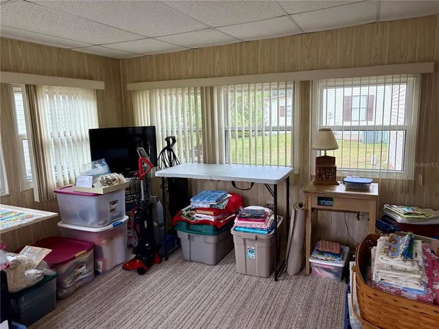 a bedroom with furniture and a wooden floor