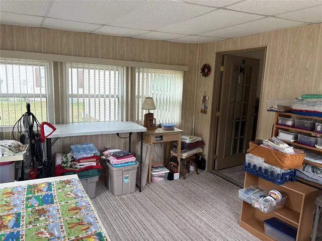 a living room with furniture a fireplace and windows