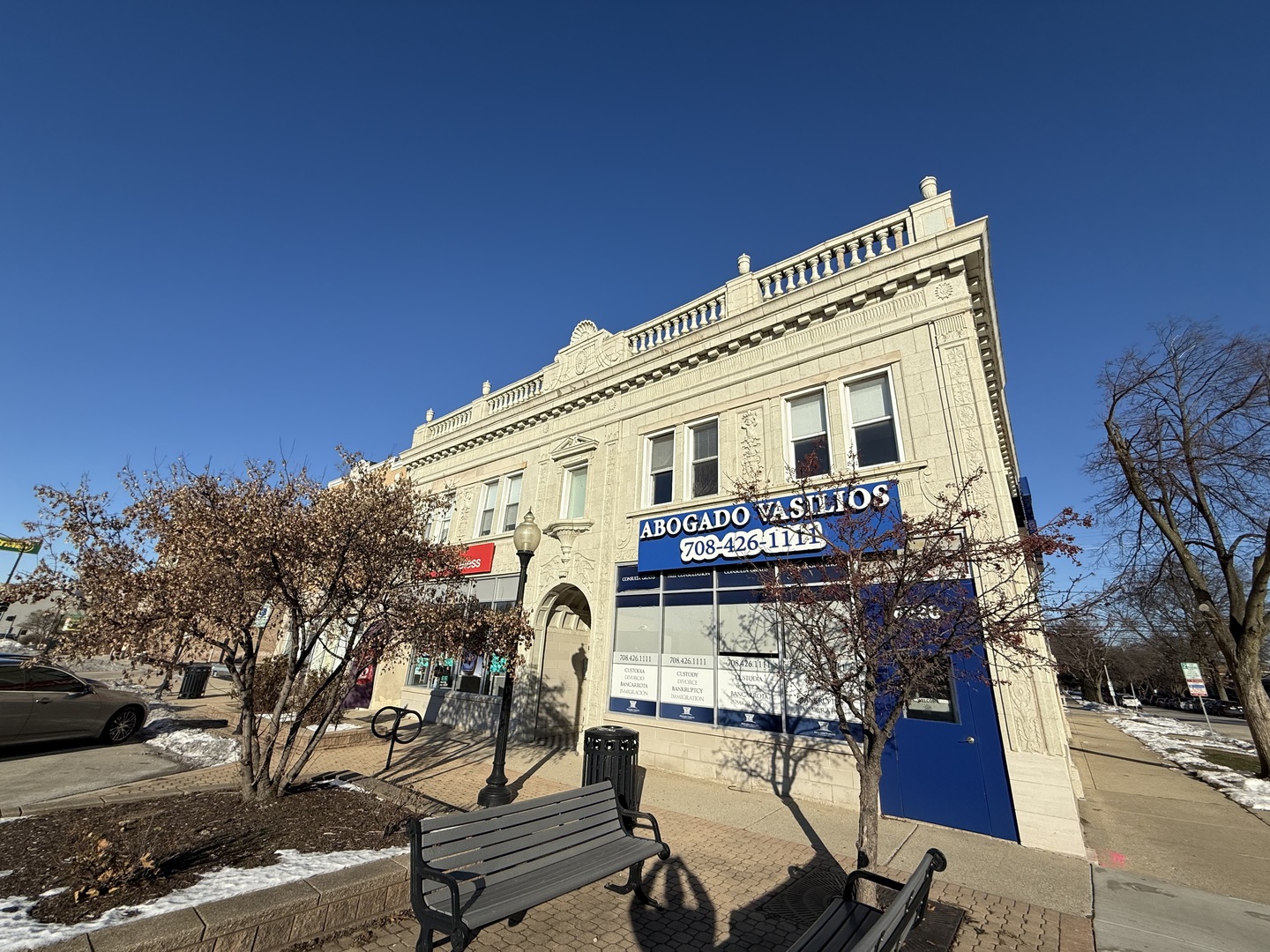 a view of a building with outdoor seating