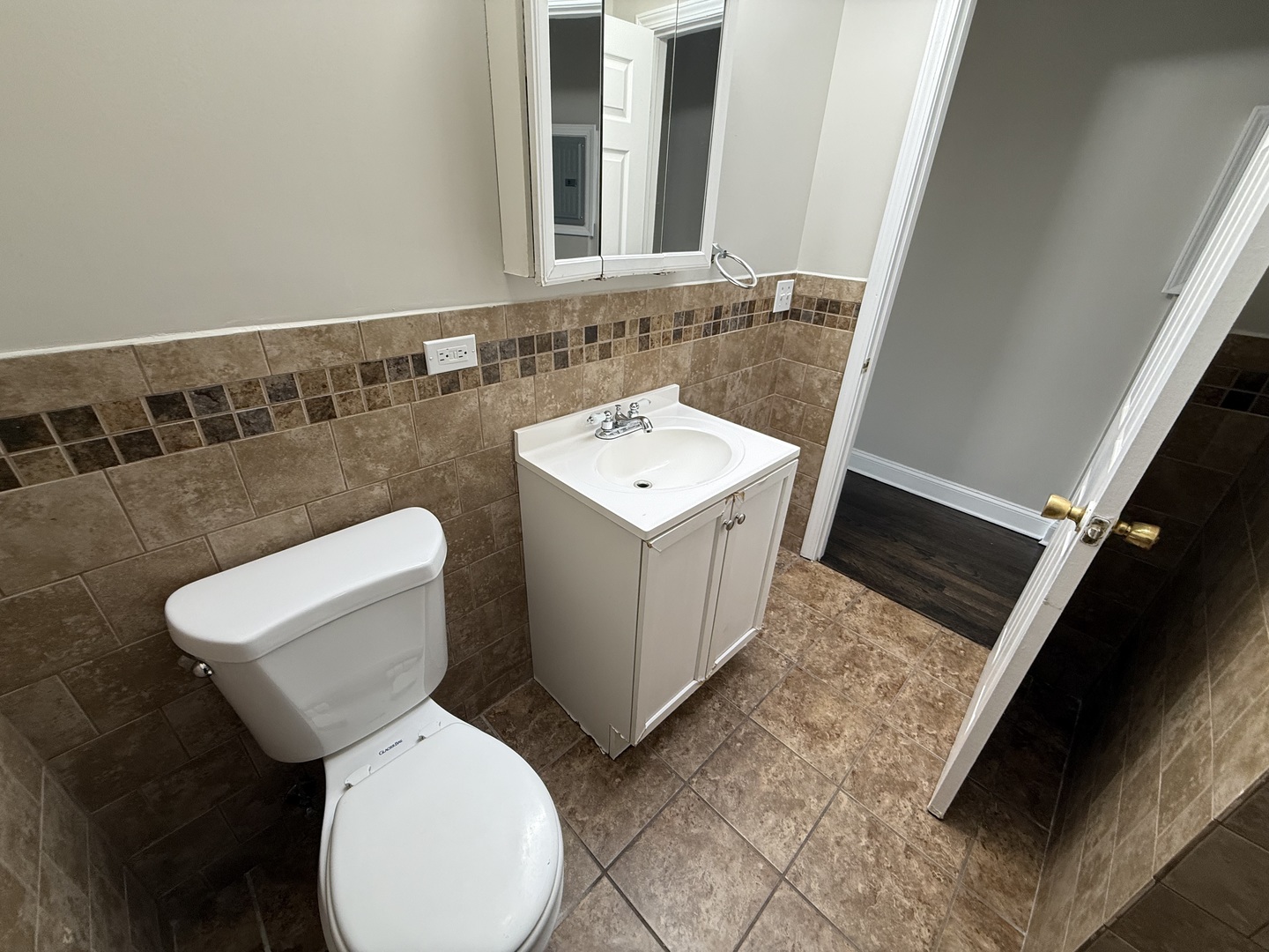 6626 Cermak Road, Unit 1F Berwyn, IL 60402 - Photo 11 of 12 a white toilet sitting next to a bathroom sink