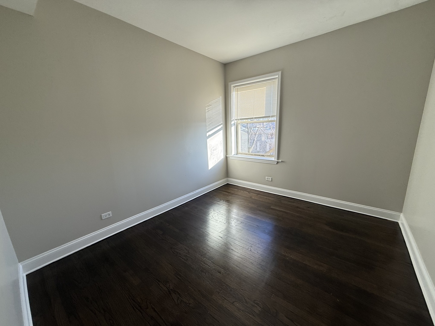 6626 Cermak Road, Unit 1F Berwyn, IL 60402 - Photo 6 of 12 an empty room with wooden floor and windows