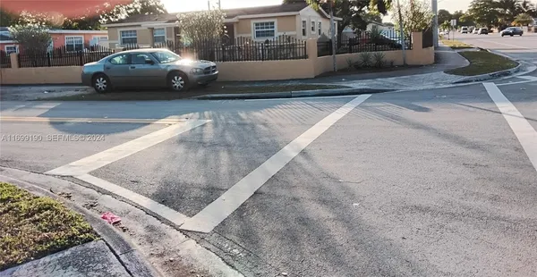 a view of a car parked on the side of the road