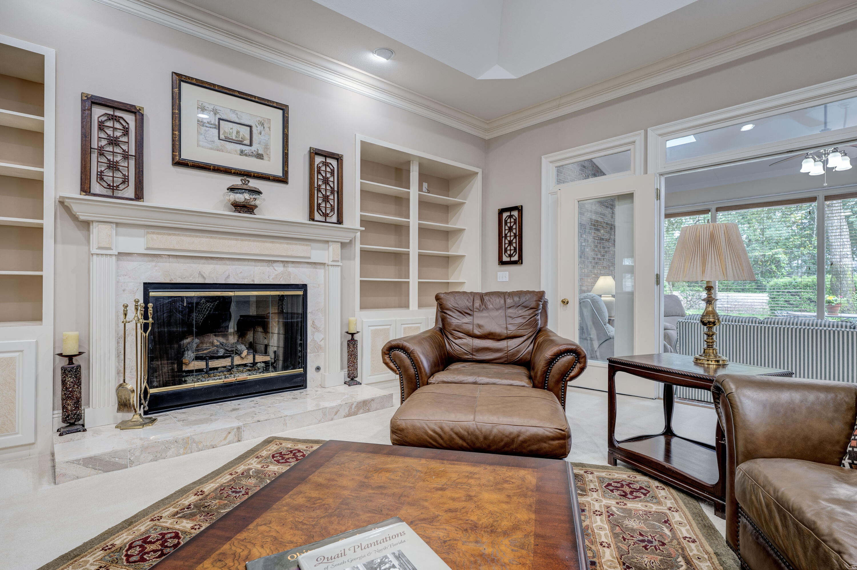 4418 Windrush Drive Niceville, FL 32578 - Photo 11 of 66 a living room with furniture and a fireplace