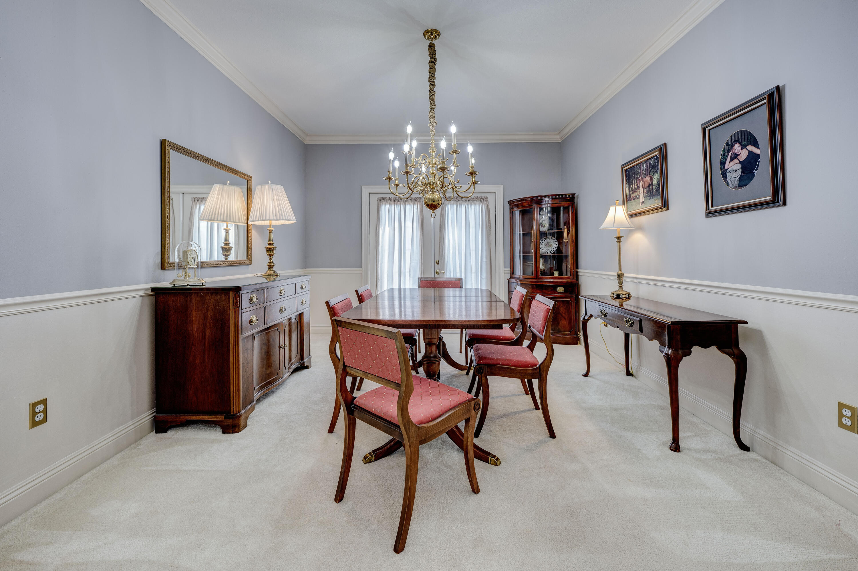 4418 Windrush Drive Niceville, FL 32578 - Photo 14 of 66 a view of a dining room with furniture and chandelier