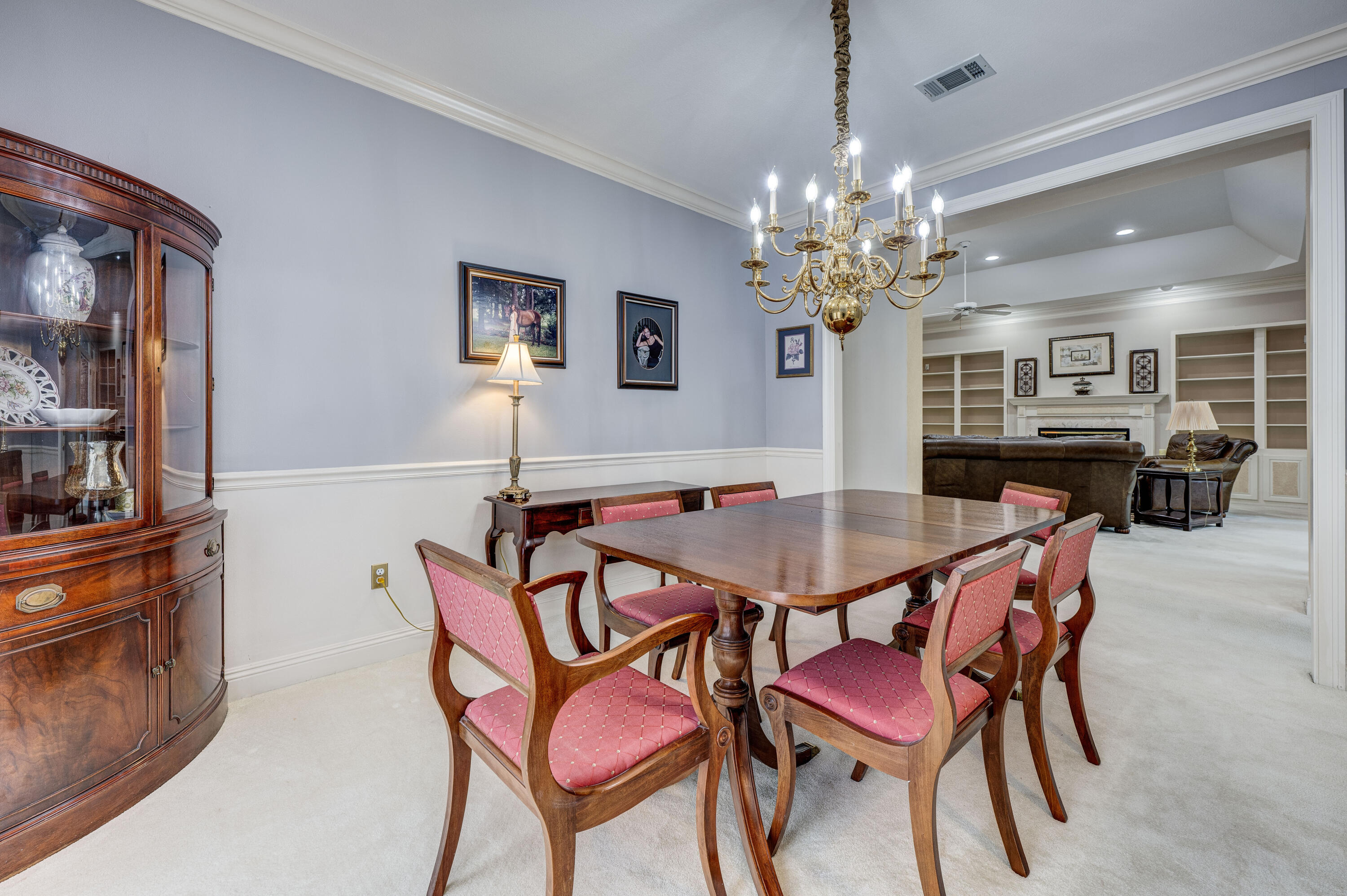 4418 Windrush Drive Niceville, FL 32578 - Photo 15 of 66 a dining room with furniture and chandelier
