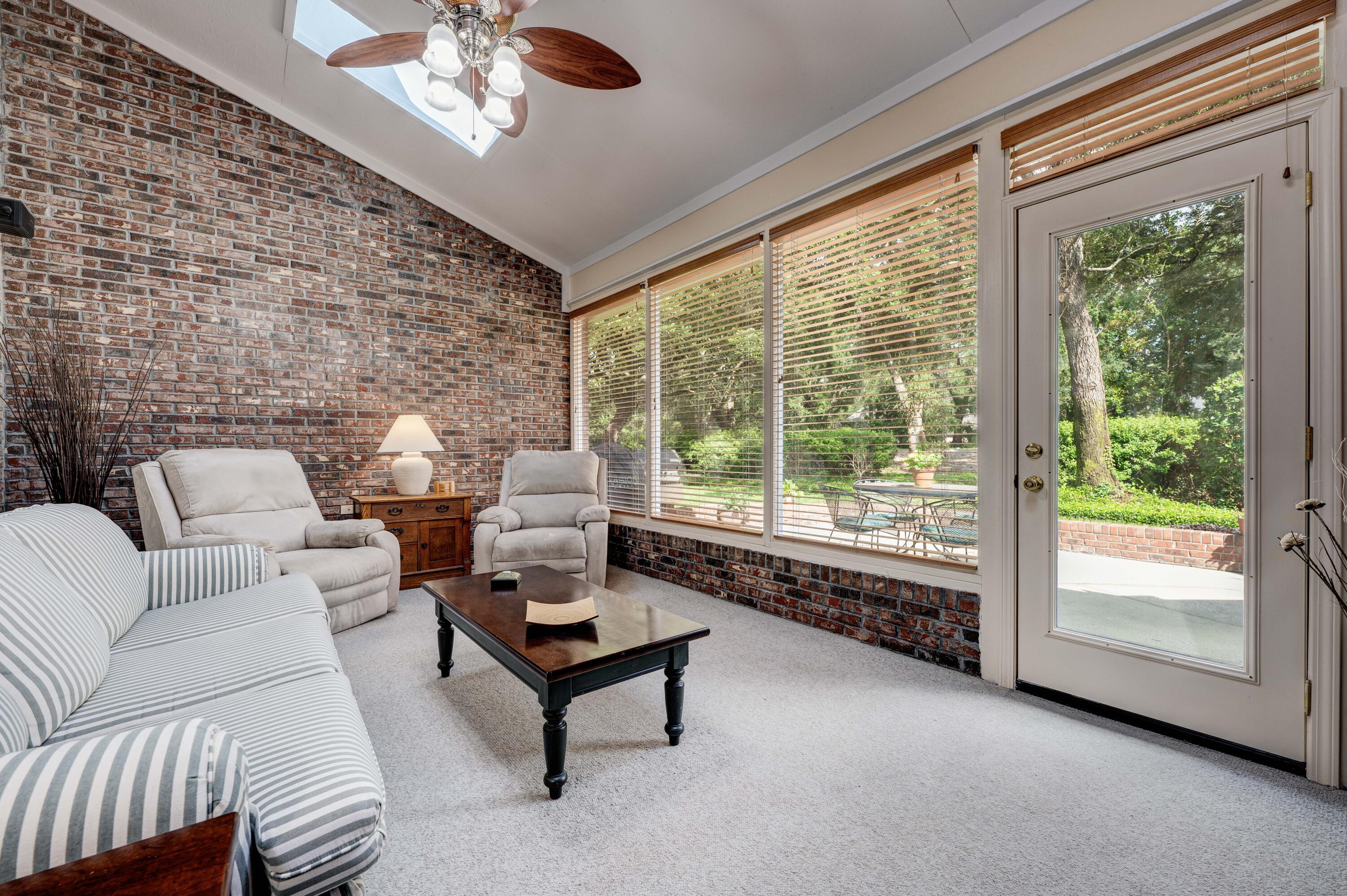 4418 Windrush Drive Niceville, FL 32578 - Photo 16 of 66 a living room with furniture and a large window