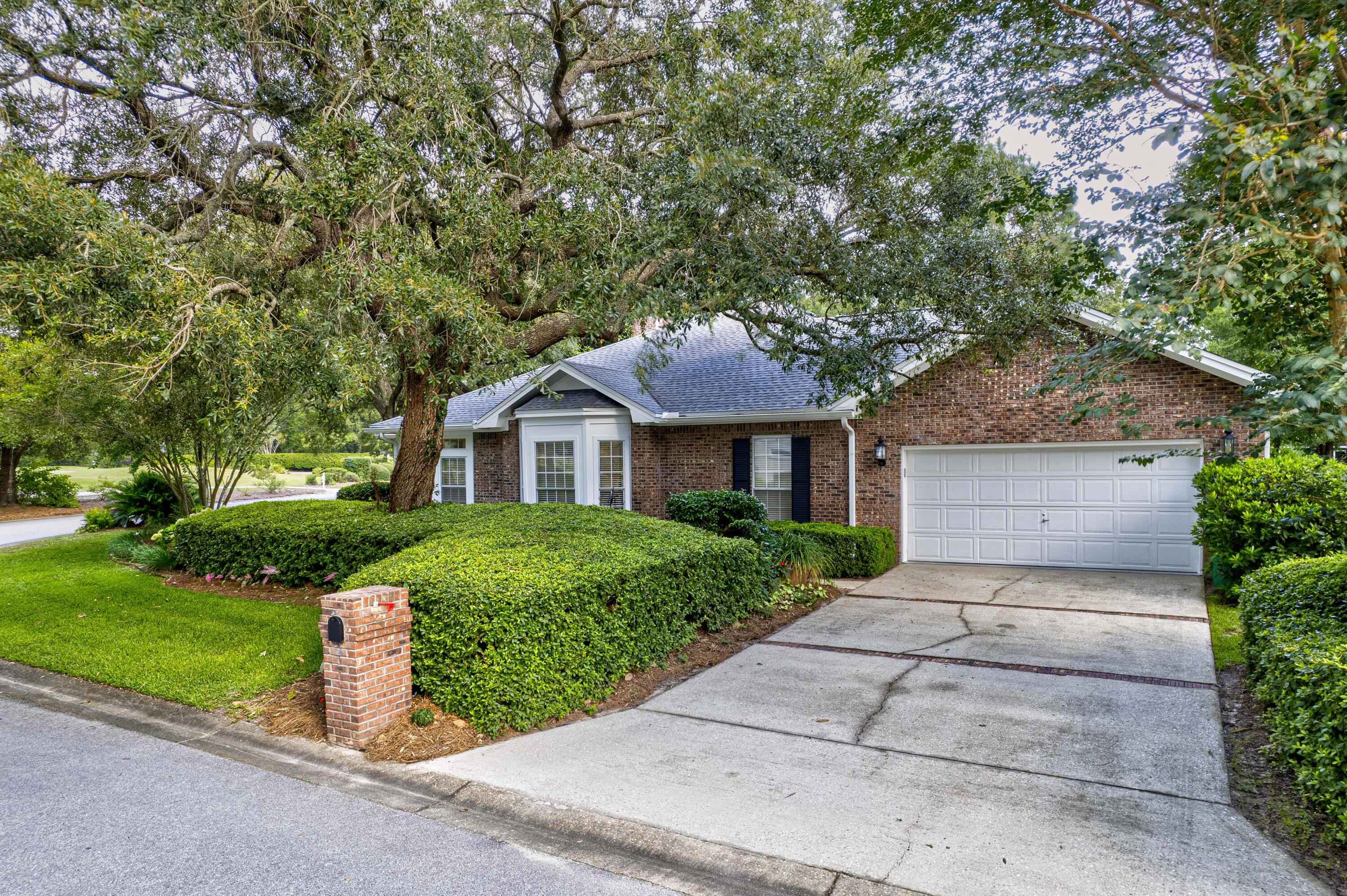 4418 Windrush Drive Niceville, FL 32578 - Photo 2 of 66 a front view of a house with a yard