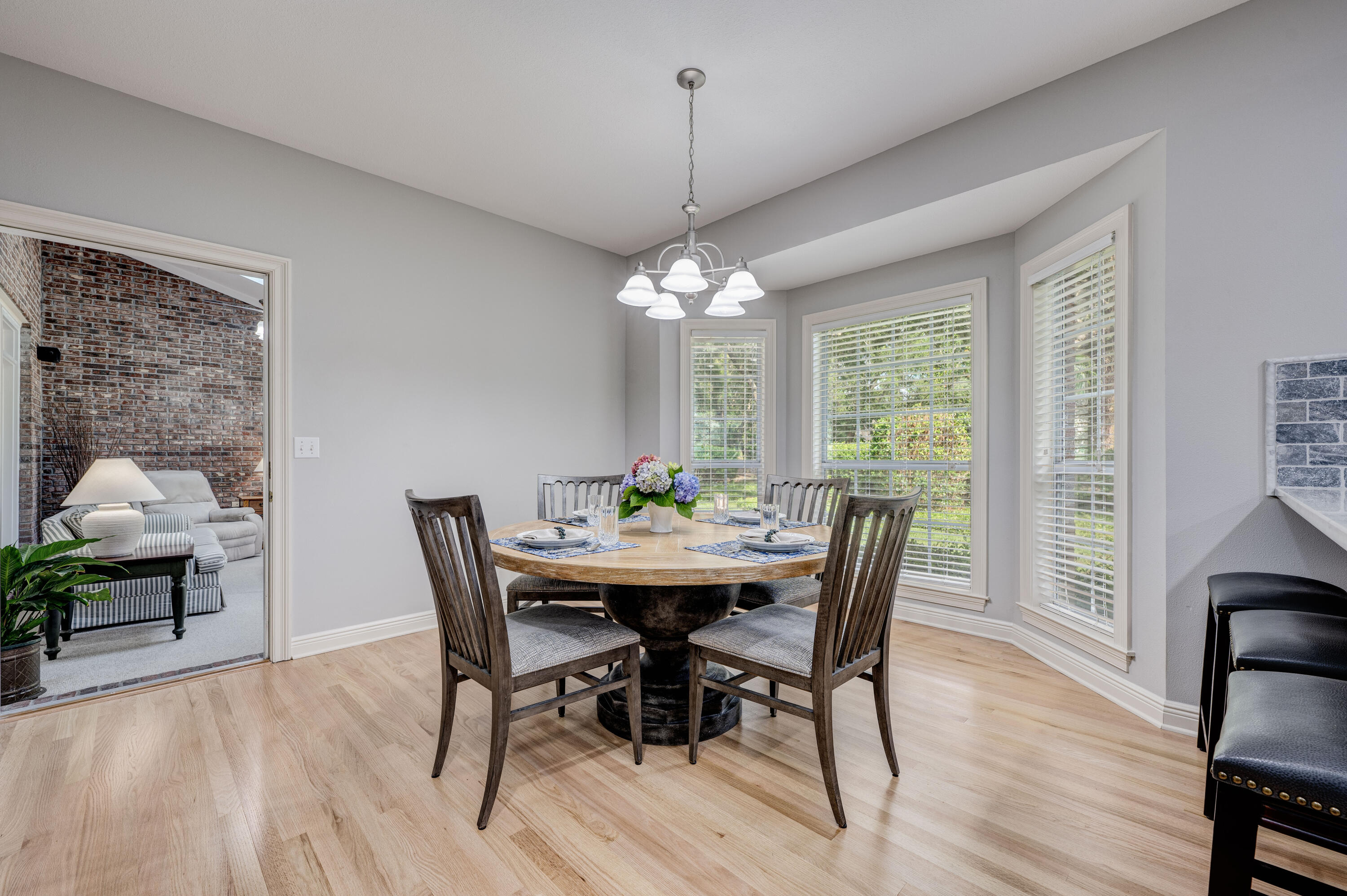 4418 Windrush Drive Niceville, FL 32578 - Photo 21 of 66 a dining room with furniture window wooden floor
