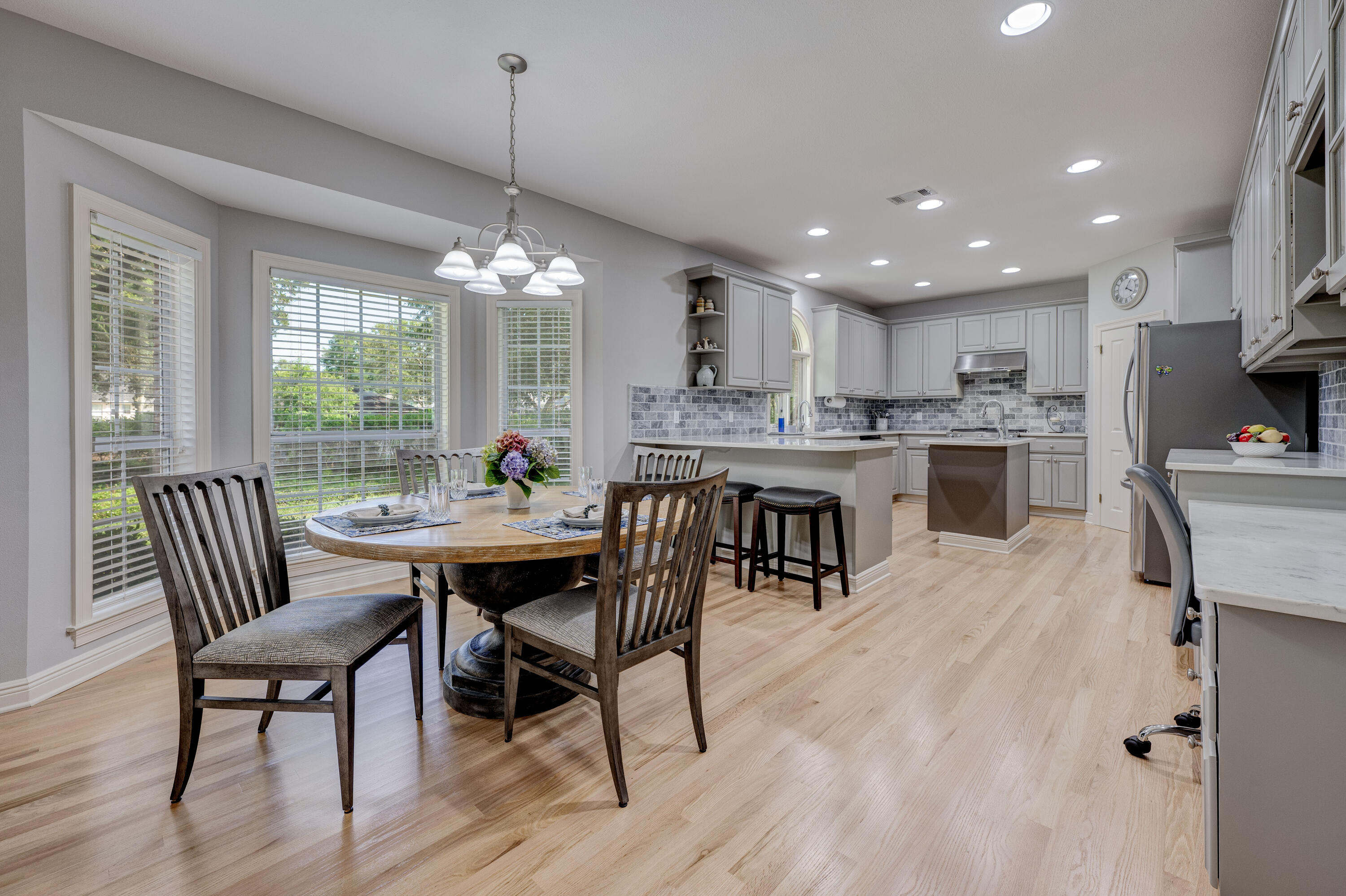 4418 Windrush Drive Niceville, FL 32578 - Photo 22 of 66 a dining room filled chandelier and wooden floor