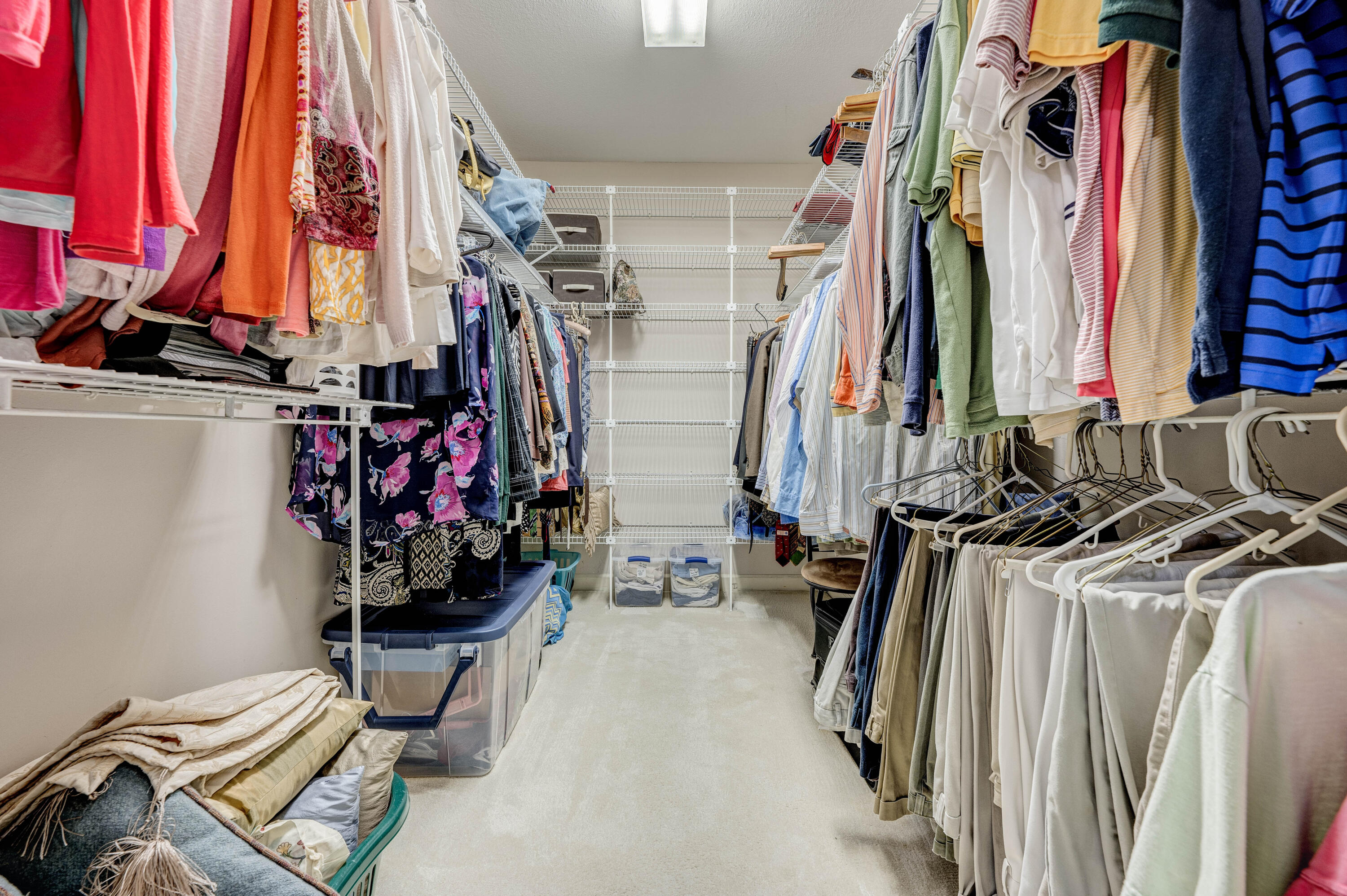 4418 Windrush Drive Niceville, FL 32578 - Photo 34 of 66 a view of walk in closet with clothes