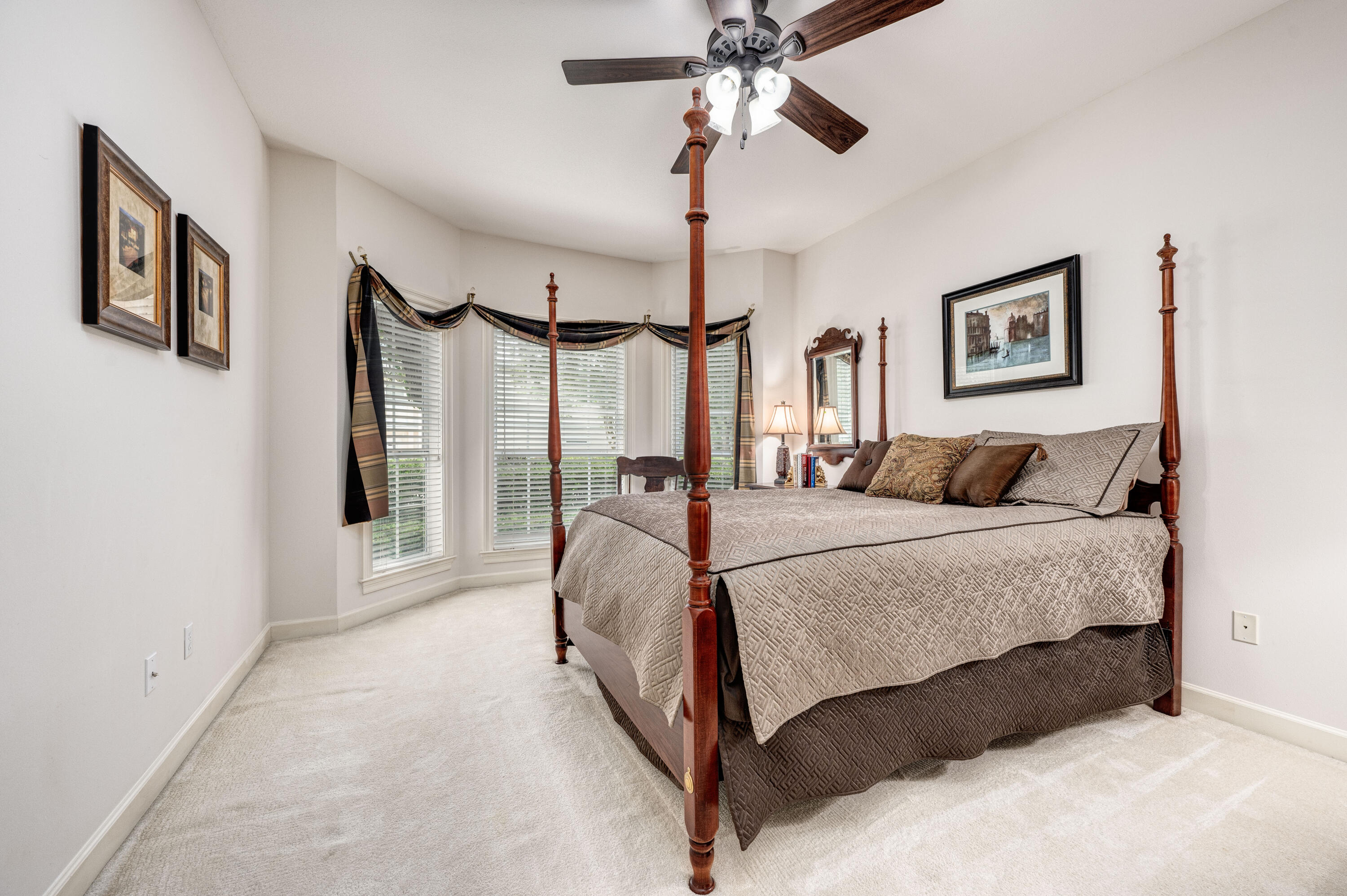 4418 Windrush Drive Niceville, FL 32578 - Photo 40 of 66 a bedroom with a bed mirror and window