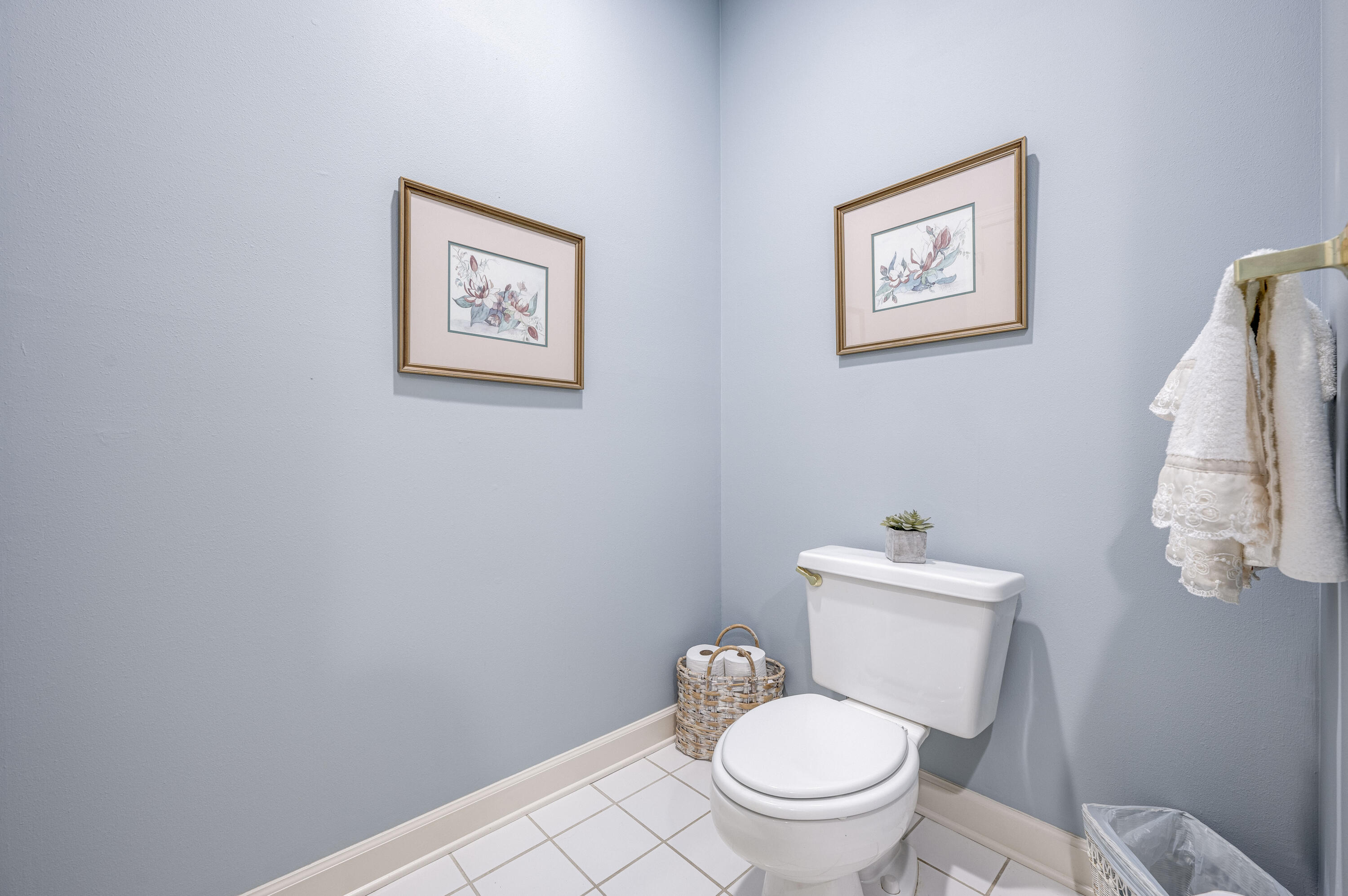 4418 Windrush Drive Niceville, FL 32578 - Photo 44 of 66 a white toilet sitting next to a bathroom sink