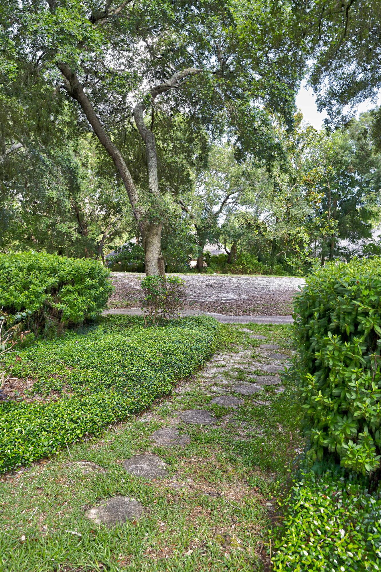 4418 Windrush Drive Niceville, FL 32578 - Photo 50 of 66 a view of a yard with large trees
