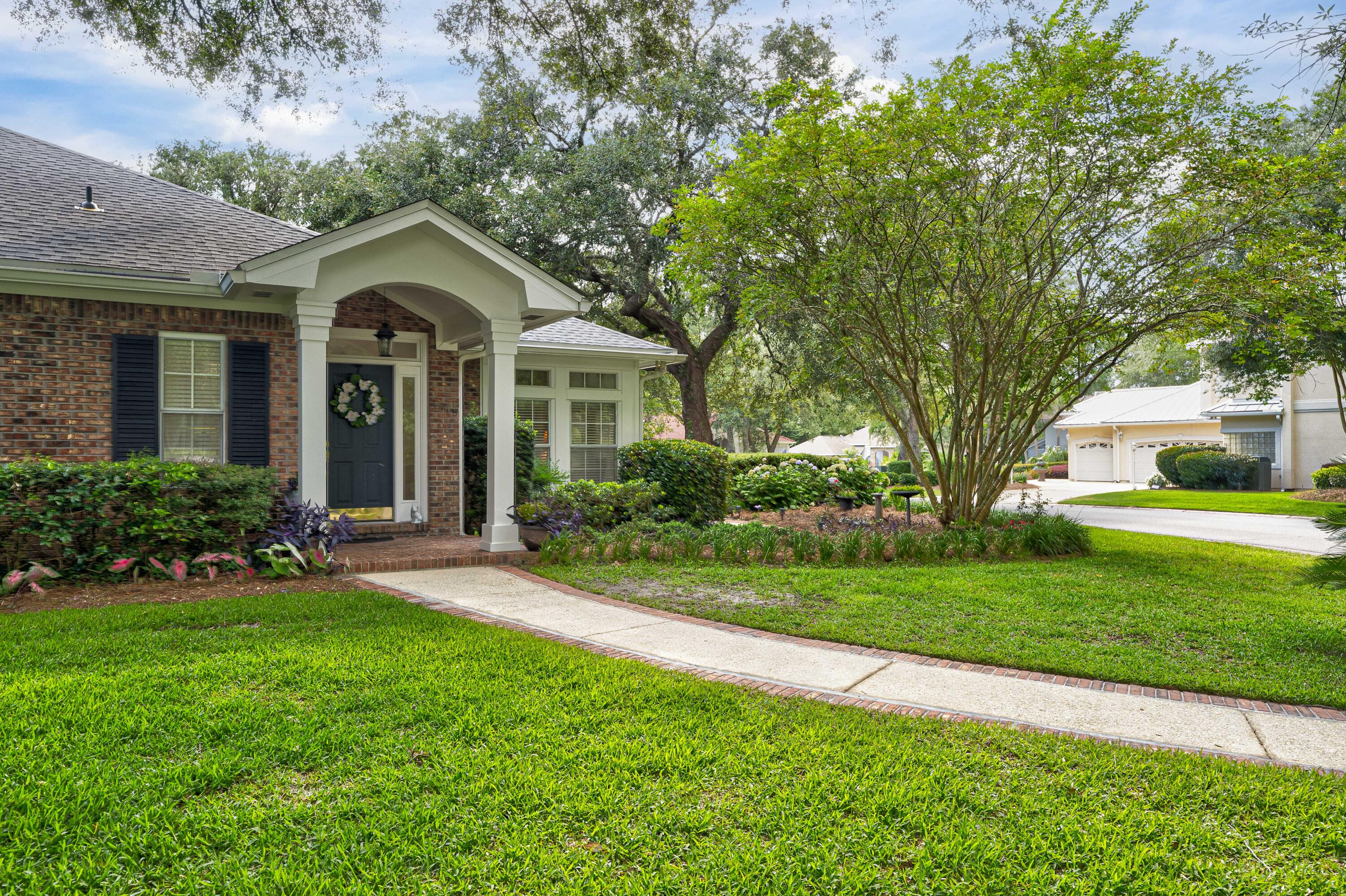 4418 Windrush Drive Niceville, FL 32578 - Photo 54 of 66 a front view of a house with a yard
