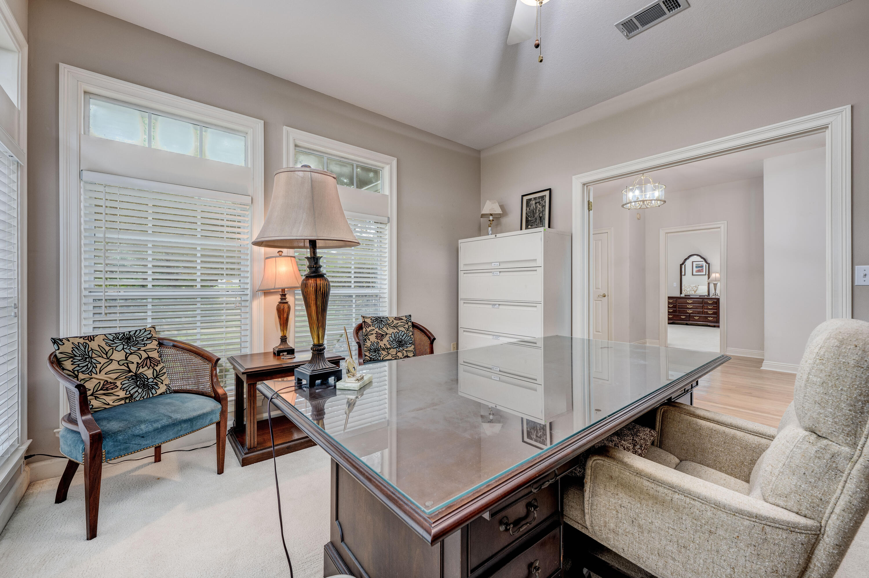 4418 Windrush Drive Niceville, FL 32578 - Photo 7 of 66 a dining room with furniture and wooden floor