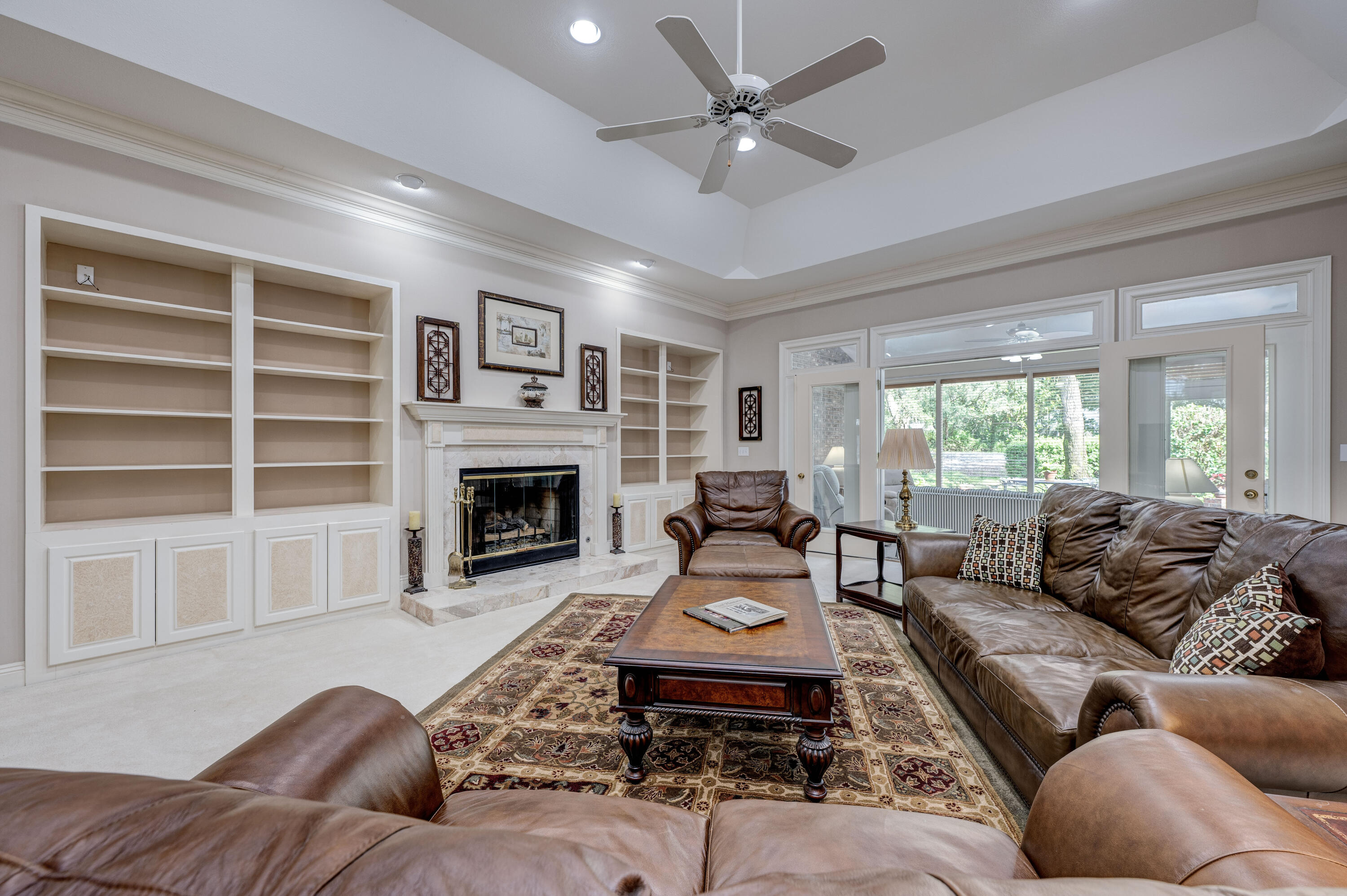 4418 Windrush Drive Niceville, FL 32578 - Photo 10 of 66 a living room with furniture or window and a fireplace
