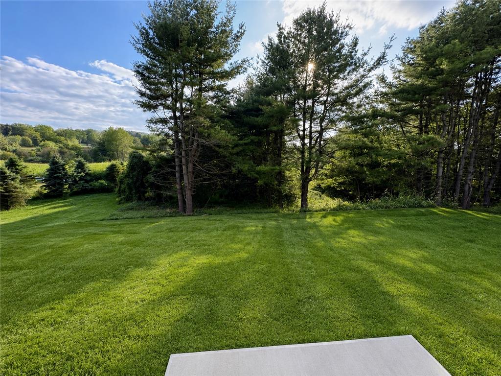 3104 Moyer Road Hellertown, PA 18055 - Photo 25 of 30 Mature trees frame a manicured green lawn looking out toward distant rolling hills.