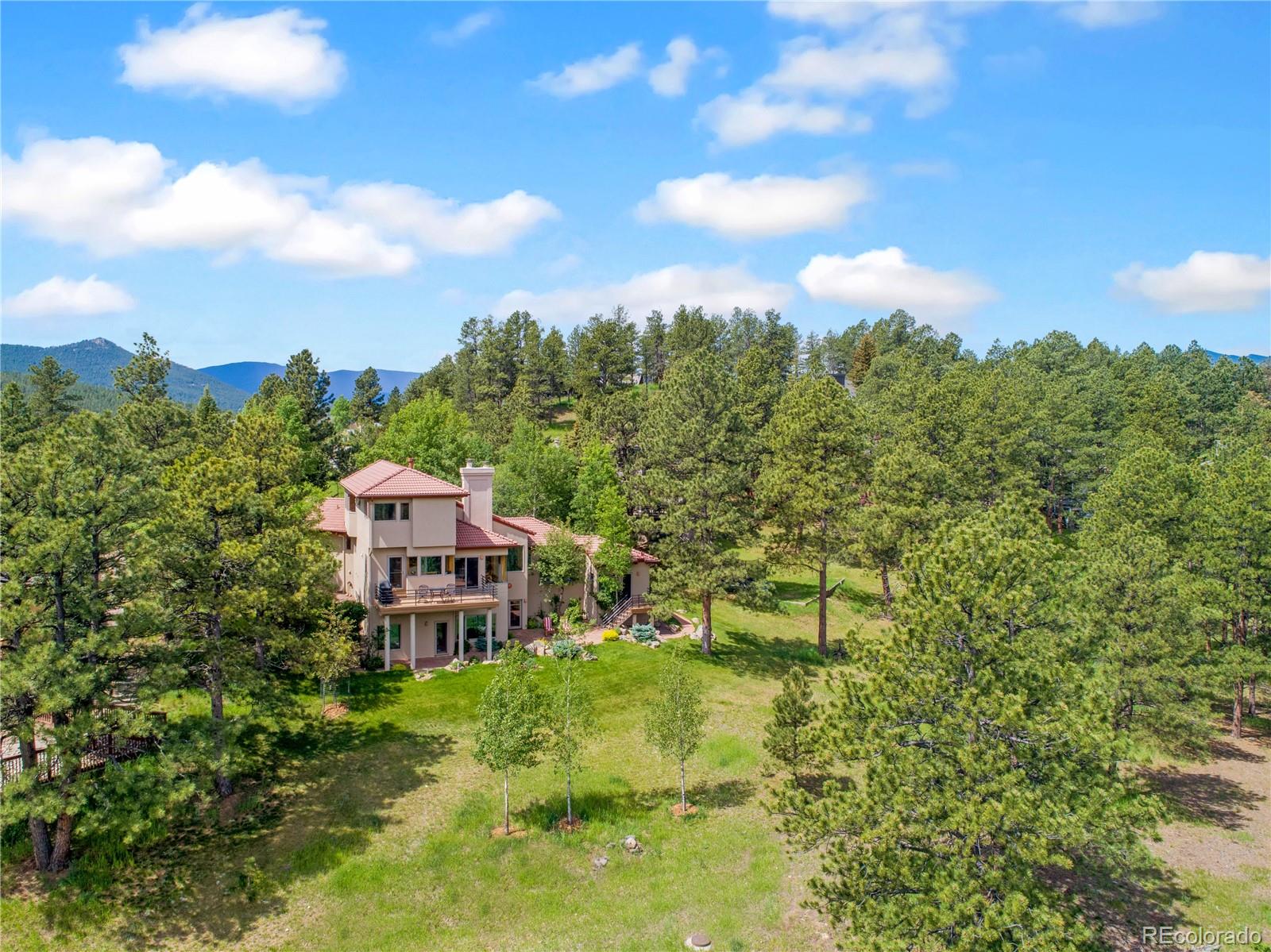 2398 Bitterroot Lane Golden, CO 80401 - Photo 12 of 34 a aerial view of a house with a yard