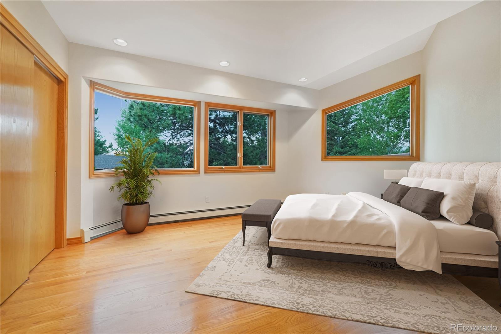 2398 Bitterroot Lane Golden, CO 80401 - Photo 20 of 34 a bedroom with a bed and large windows