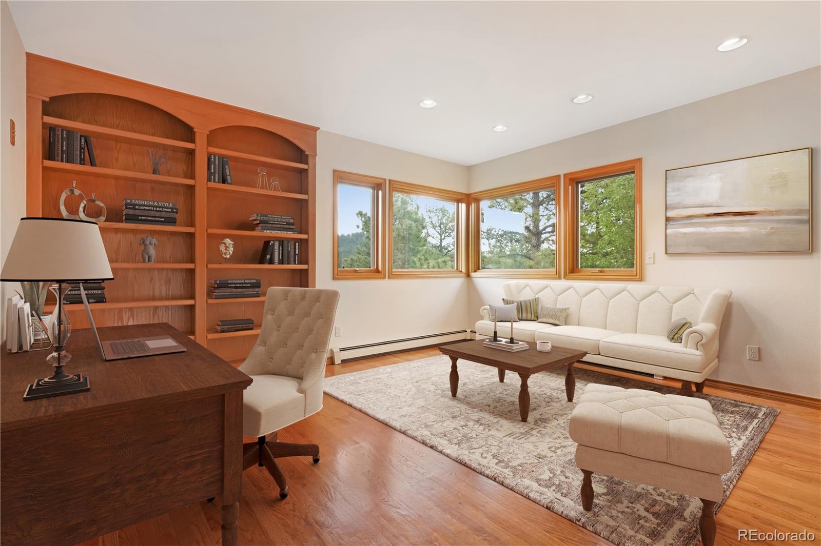 2398 Bitterroot Lane Golden, CO 80401 - Photo 21 of 34 a living room with furniture a rug and a lamp
