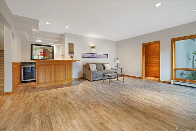 a view of a livingroom with furniture and a flat screen tv