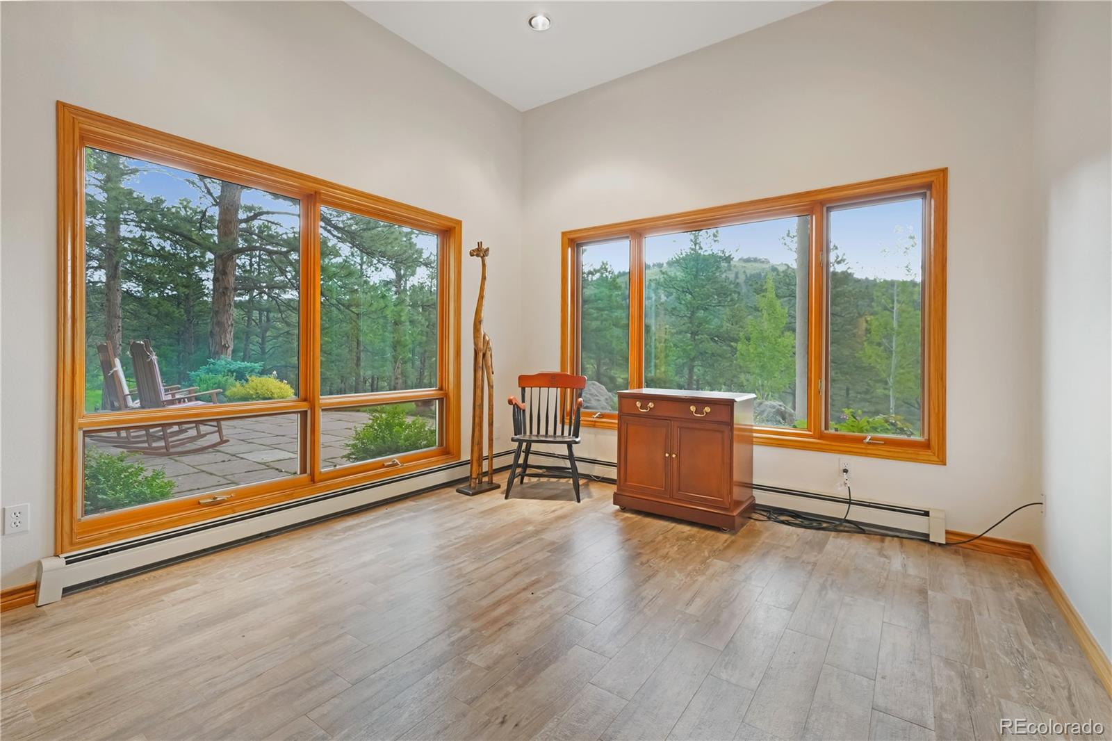 2398 Bitterroot Lane Golden, CO 80401 - Photo 25 of 34 wooden floor in an empty room with a large window