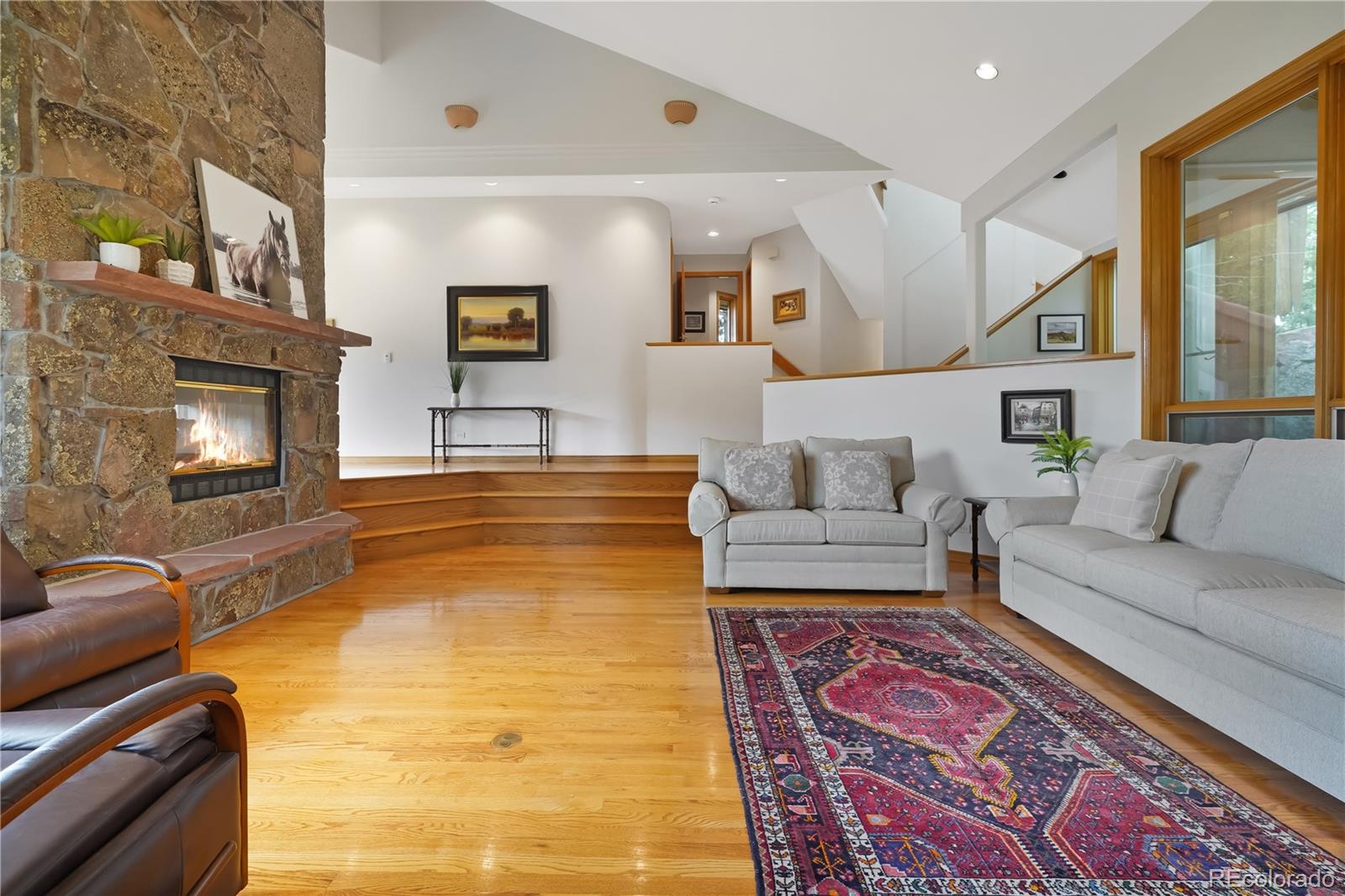 2398 Bitterroot Lane Golden, CO 80401 - Photo 7 of 34 a living room with furniture and a fireplace
