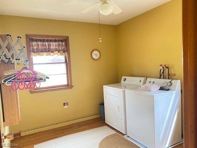 1772 Bantam Ridge Road Steubenville, OH 43953 - Photo 18 of 43 Laundry area with ceiling fan, washer and dryer, light wood-type flooring, and baseboard heating