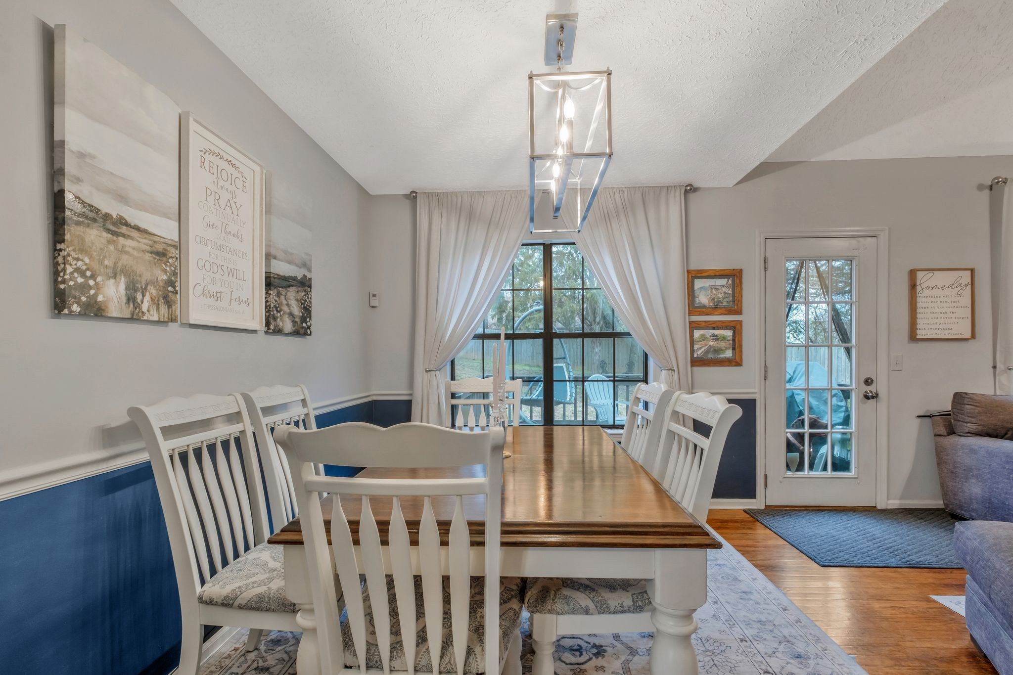 2048 Ransom Place Nashville, TN 37217 - Photo 11 of 30 a living room with furniture a chandelier and a floor to ceiling window