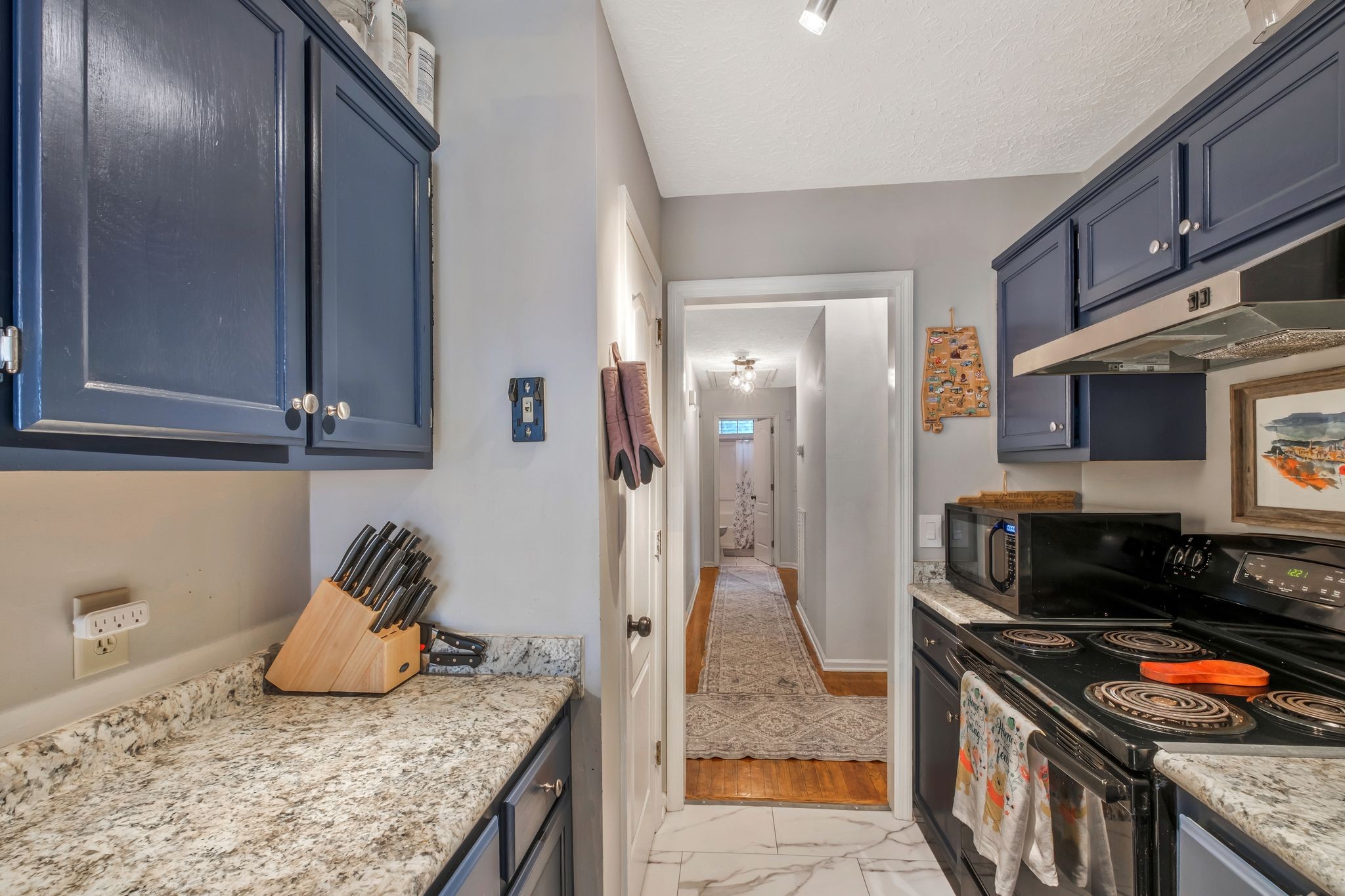 2048 Ransom Place Nashville, TN 37217 - Photo 14 of 30 a kitchen with stainless steel appliances granite countertop a stove and a refrigerator