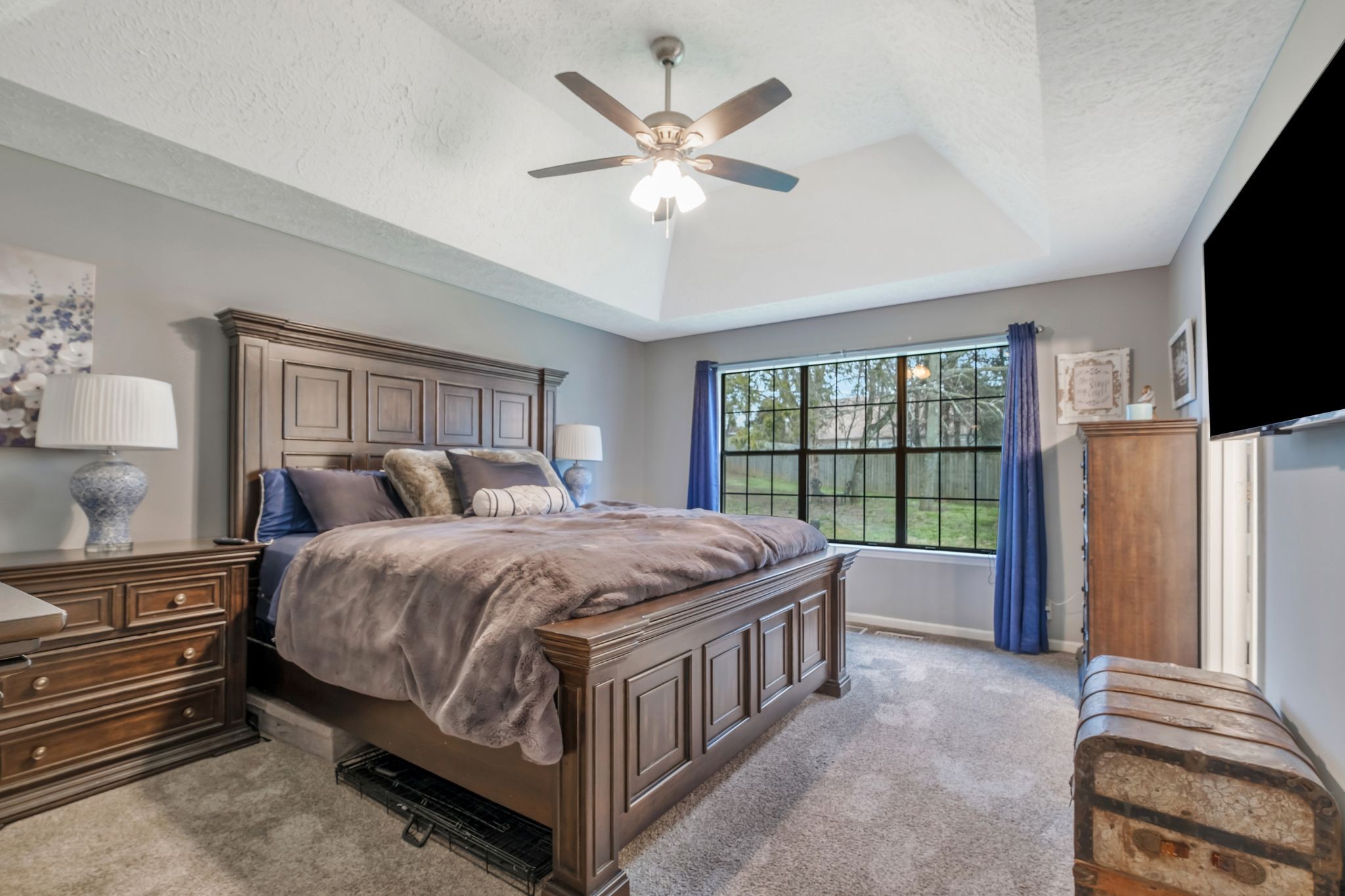 2048 Ransom Place Nashville, TN 37217 - Photo 18 of 30 a bedroom with a bed and a flat tv screen on the dresser