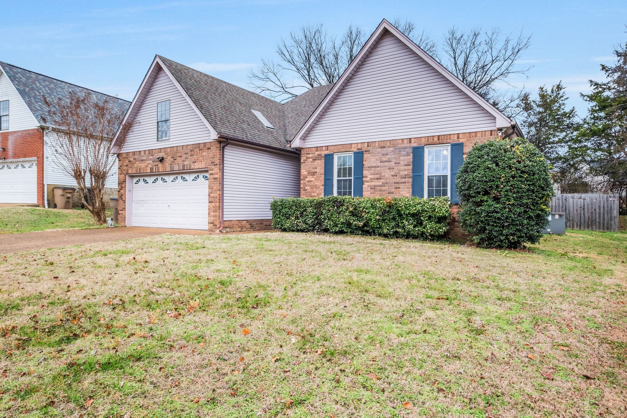 2048 Ransom Place Nashville, TN 37217 - Photo 3 of 30 a front view of a house with a yard and garage