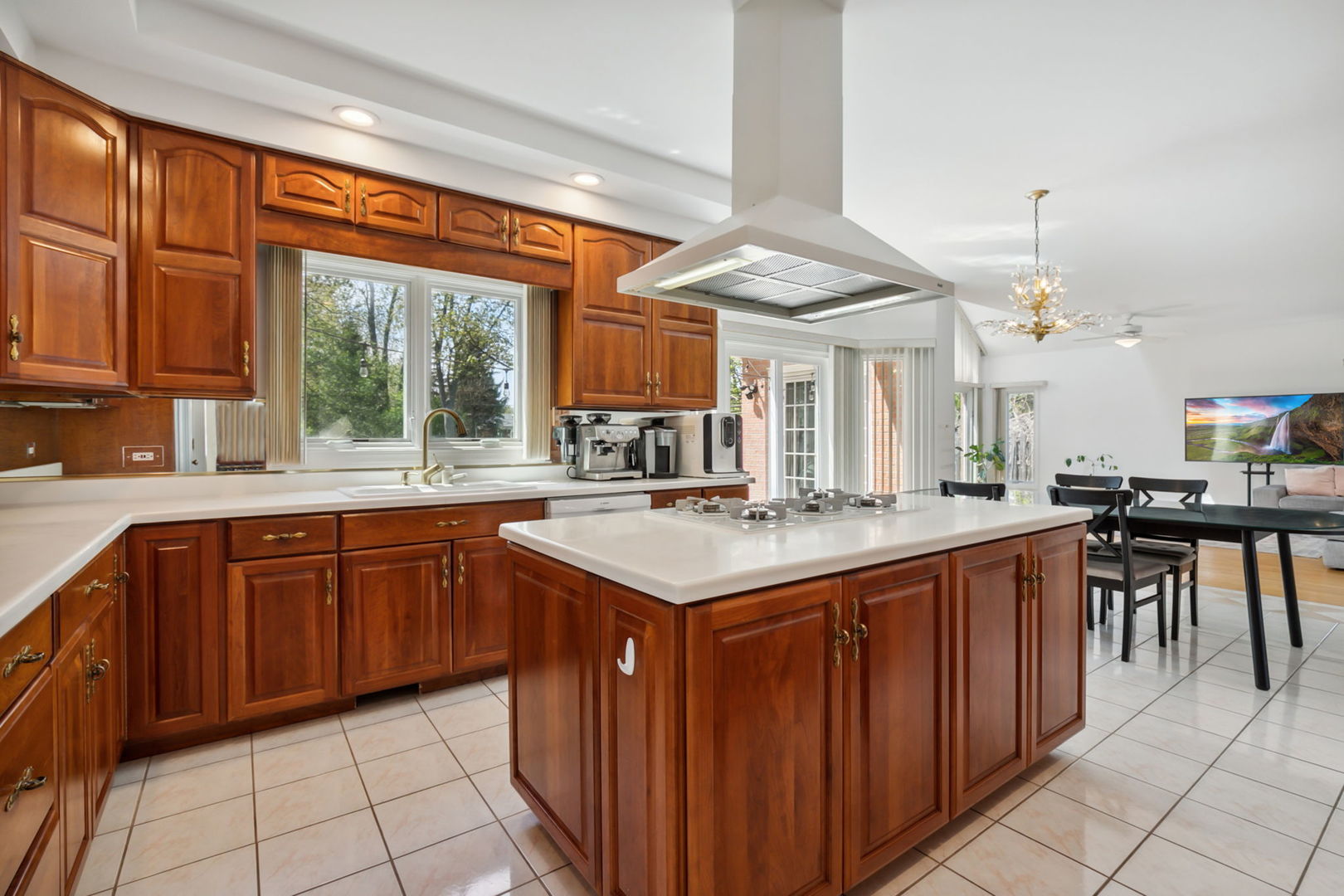 912 Elmdale Road Glenview, IL 60025 - Photo 18 of 55 a kitchen with a sink stove and cabinets