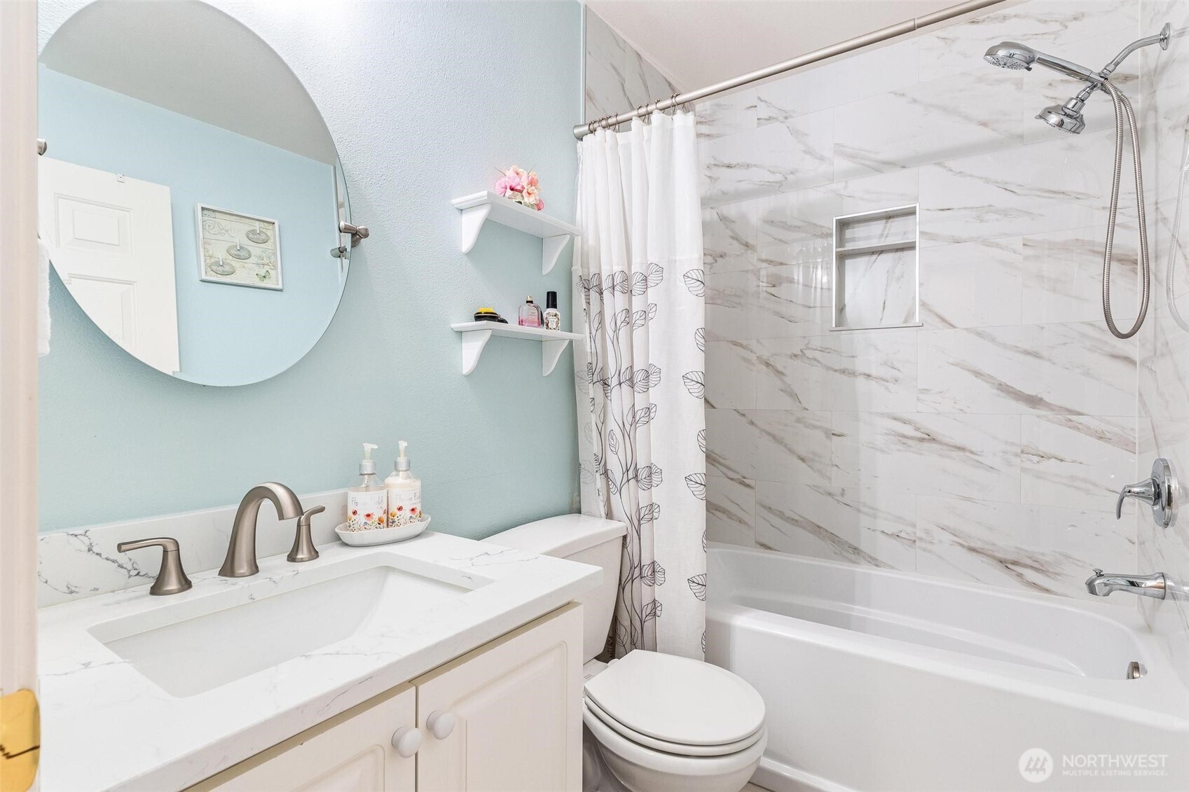 11856 Northeast 162nd Lane, Unit 94 Bothell, WA 98011 - Photo 14 of 36 a bathroom with a sink toilet and shower