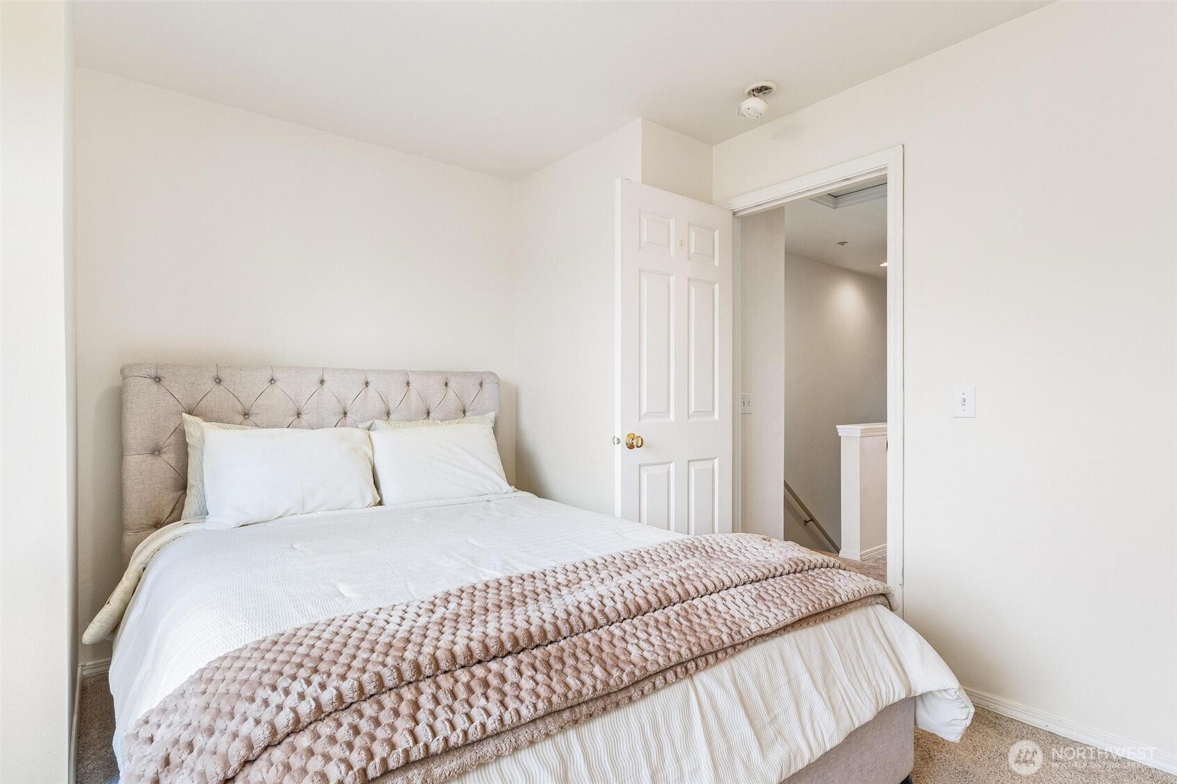 11856 Northeast 162nd Lane, Unit 94 Bothell, WA 98011 - Photo 15 of 36 a bedroom with a bed and a mirror